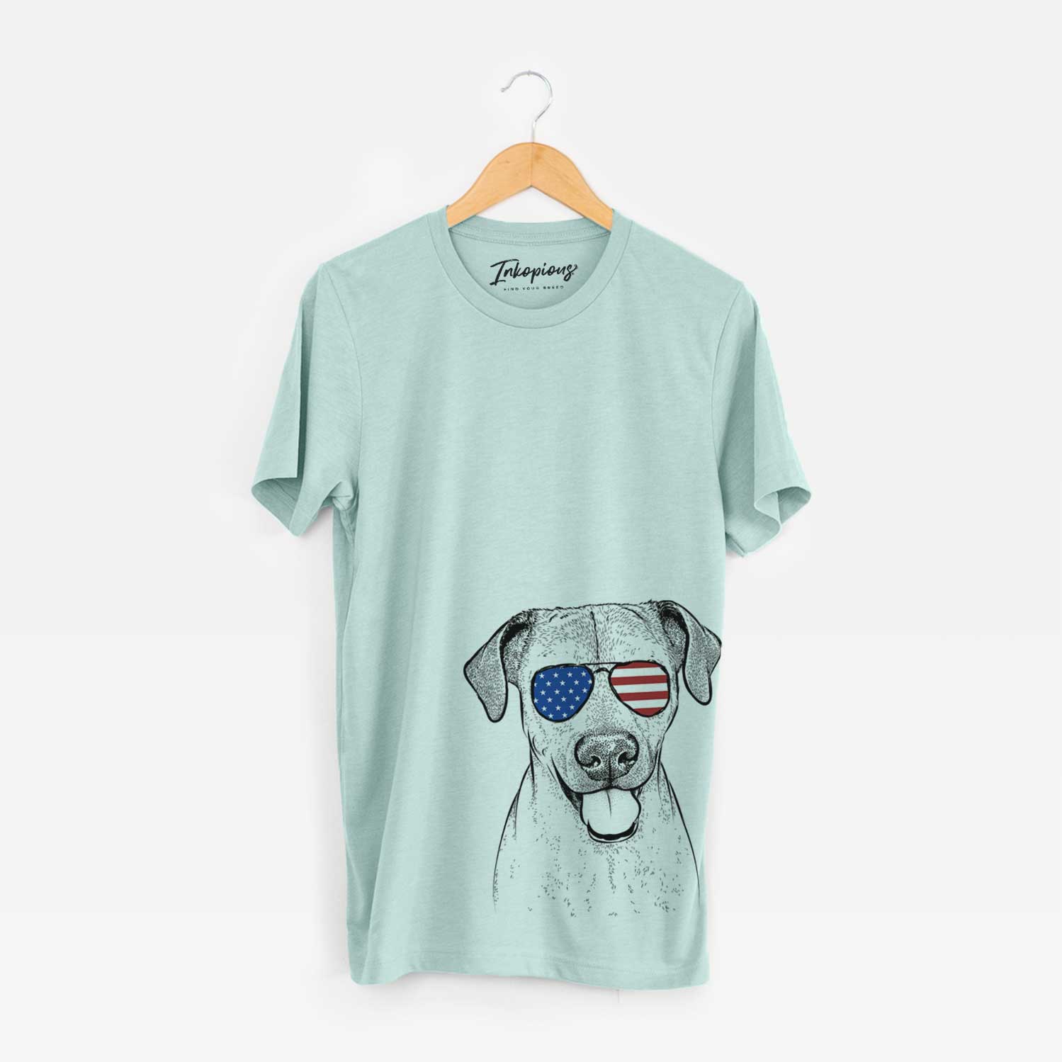 Hand-drawn sketch of Sugar the American Staffordshire Mix wearing American flag sunglasses on a Heather Sage Unisex crewneck