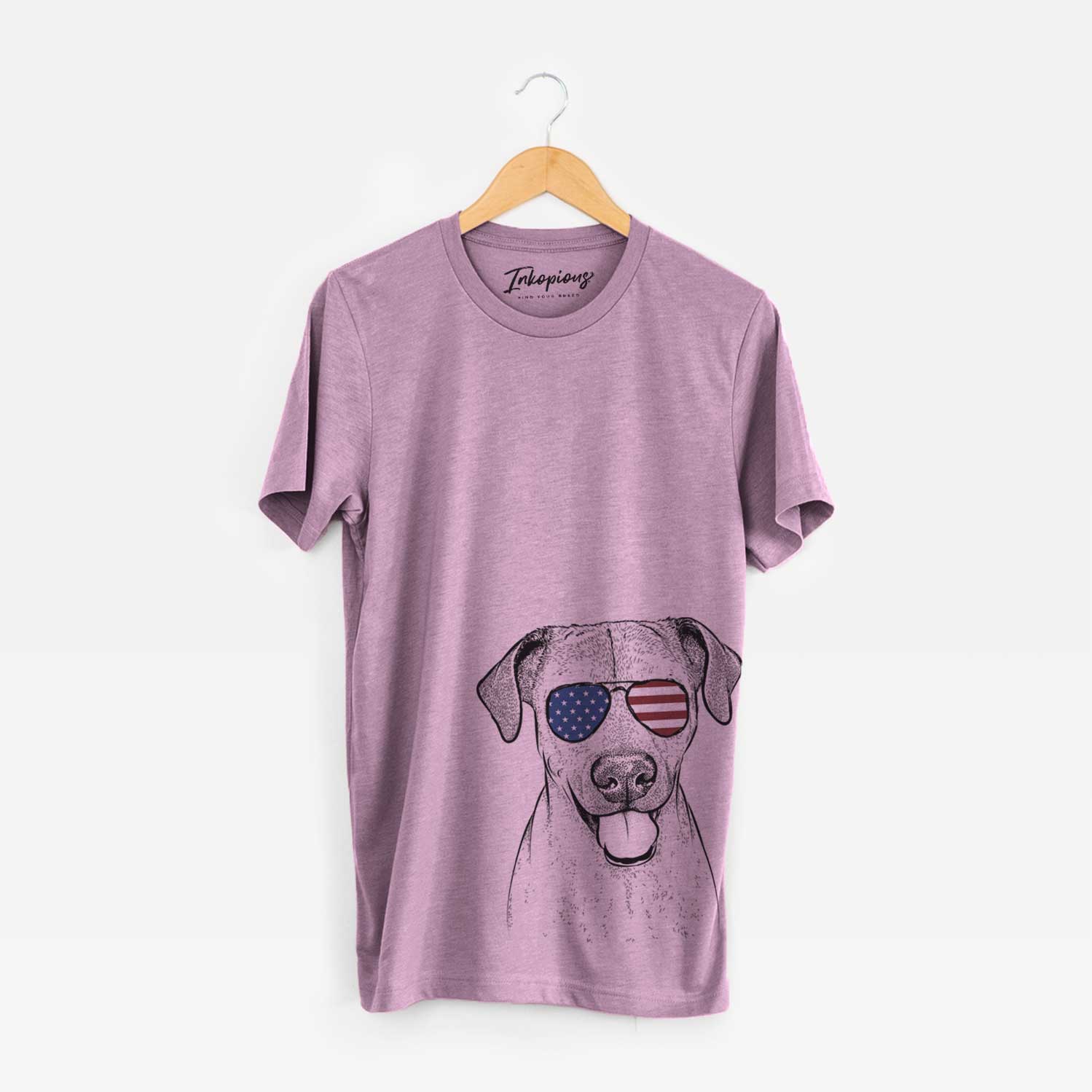 Hand-drawn sketch of Sugar the American Staffordshire Mix wearing American flag sunglasses on an Orchid Unisex crewneck