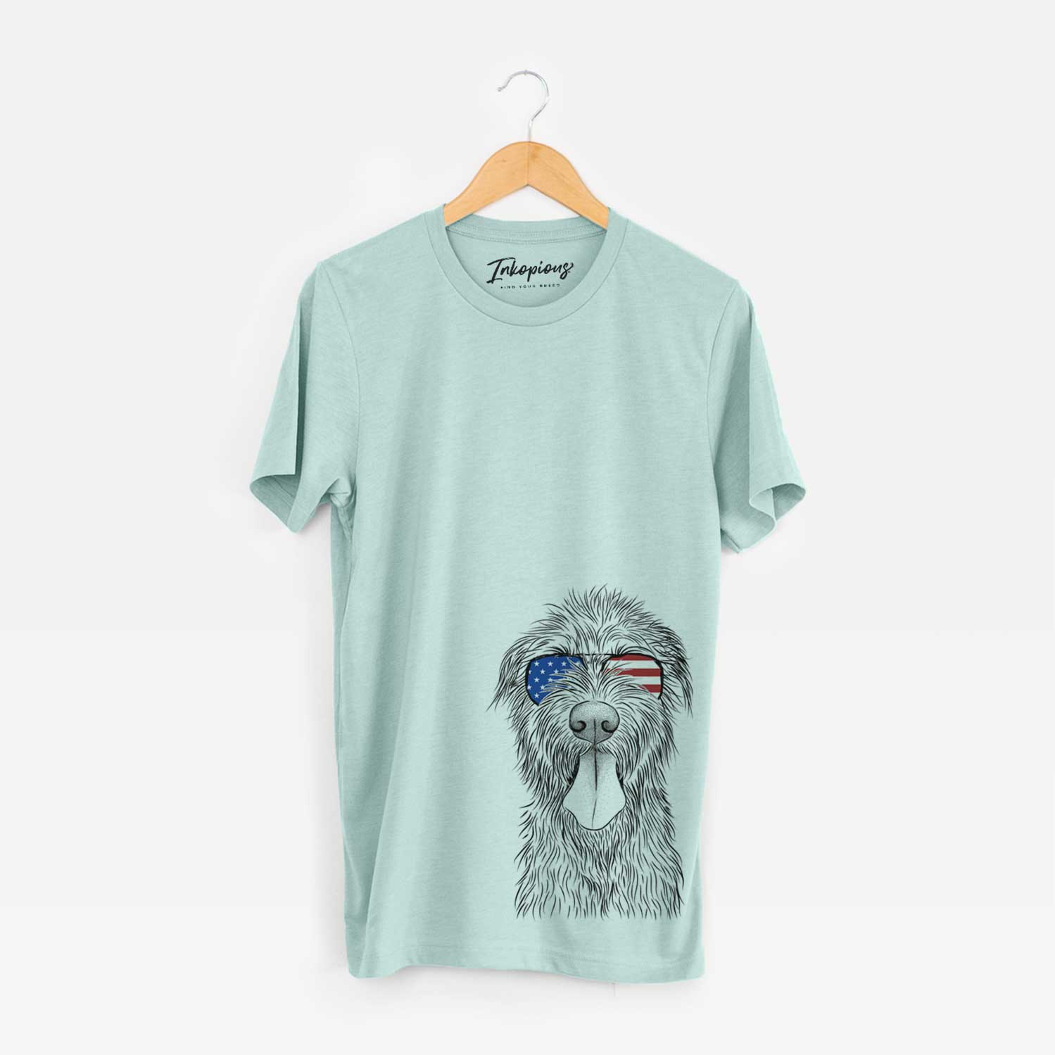 Hand-drawn sketch of Sullivan the Irish Wolfhound wearing American flag sunglasses on a Heather Sage Unisex crewneck