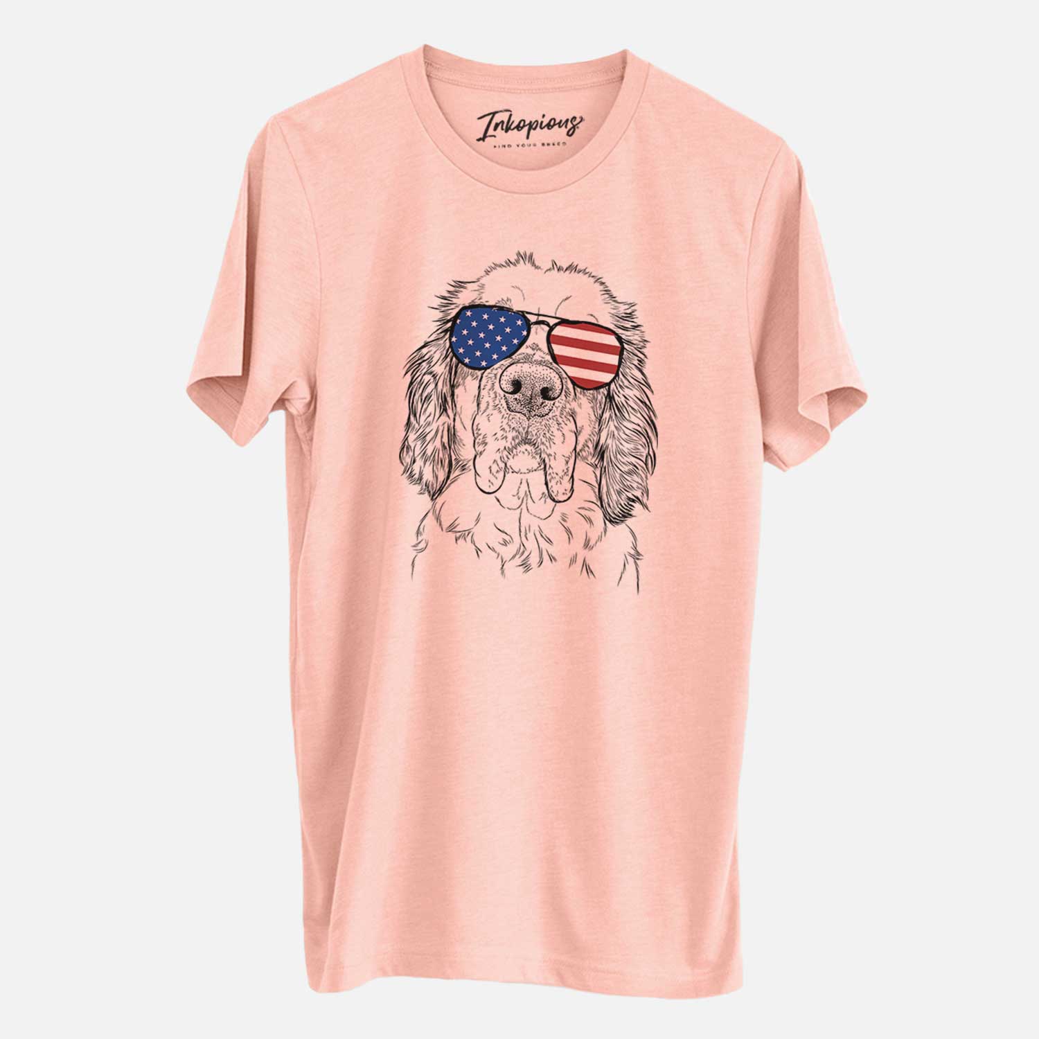 Hand-drawn sketch of Sully the Clumber Spaniel wearing American flag sunglasses on a Peach Unisex crewneck