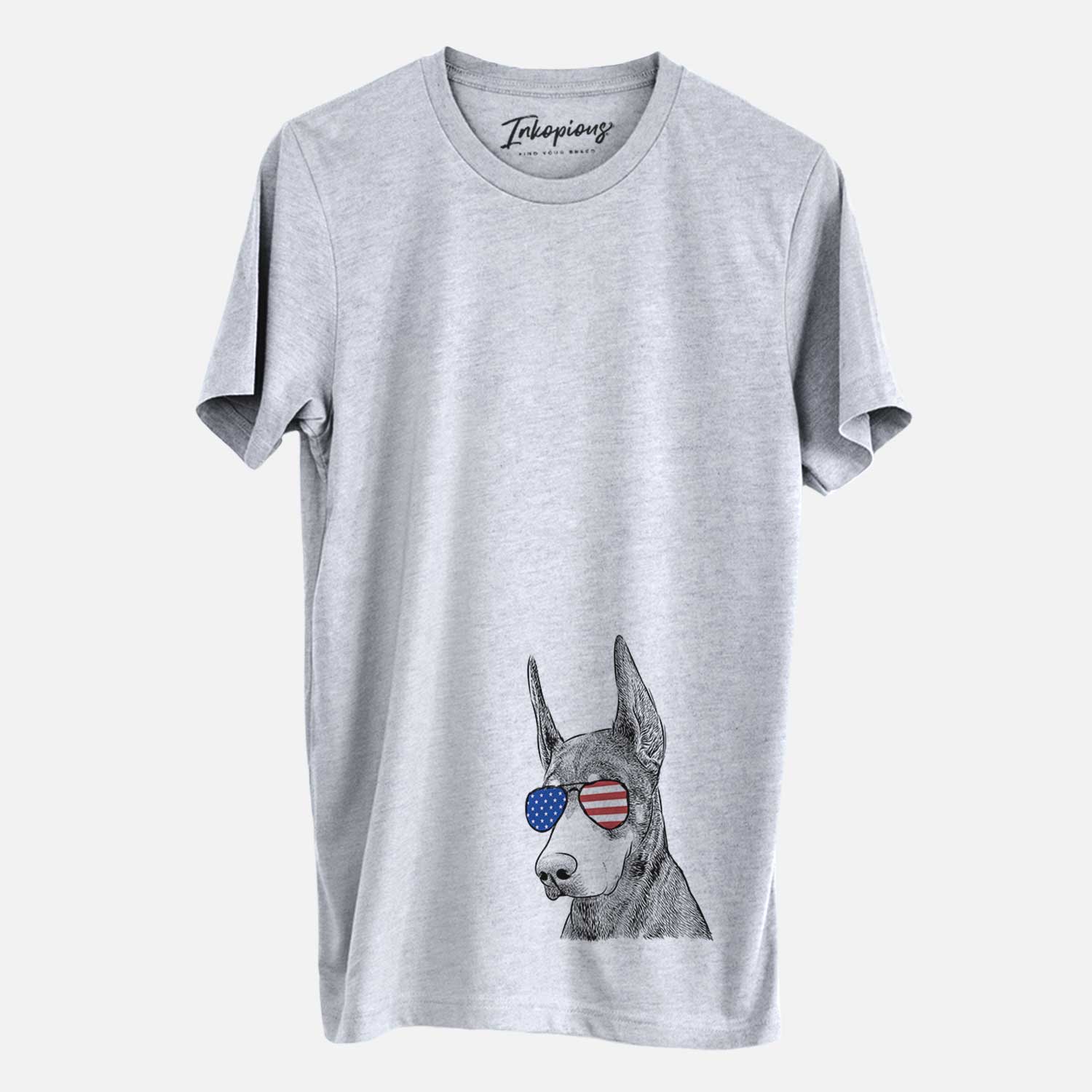Hand-drawn sketch of Sunny the Doberman Pinscher wearing American flag sunglasses on a Grey Unisex crewneck