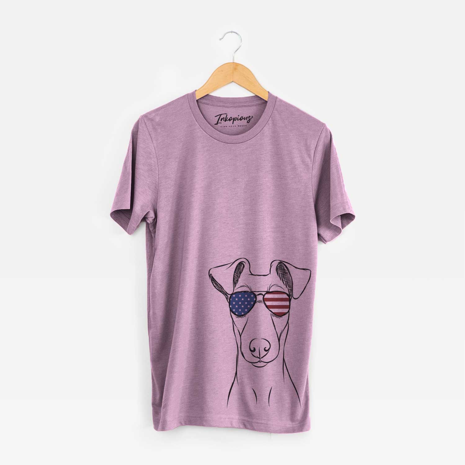 Hand-drawn sketch of Tanner the Fox Terrier wearing American flag sunglasses on an Orchid Unisex crewneck