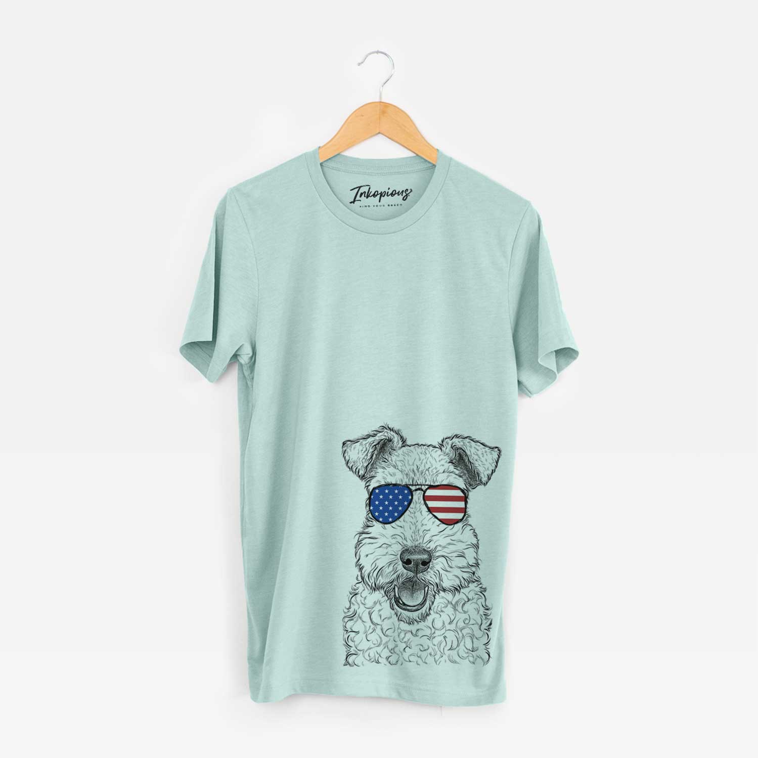 Hand-drawn sketch of Ted the Wire Fox Terrier wearing American flag sunglasses on a Heather Sage Unisex crewneck