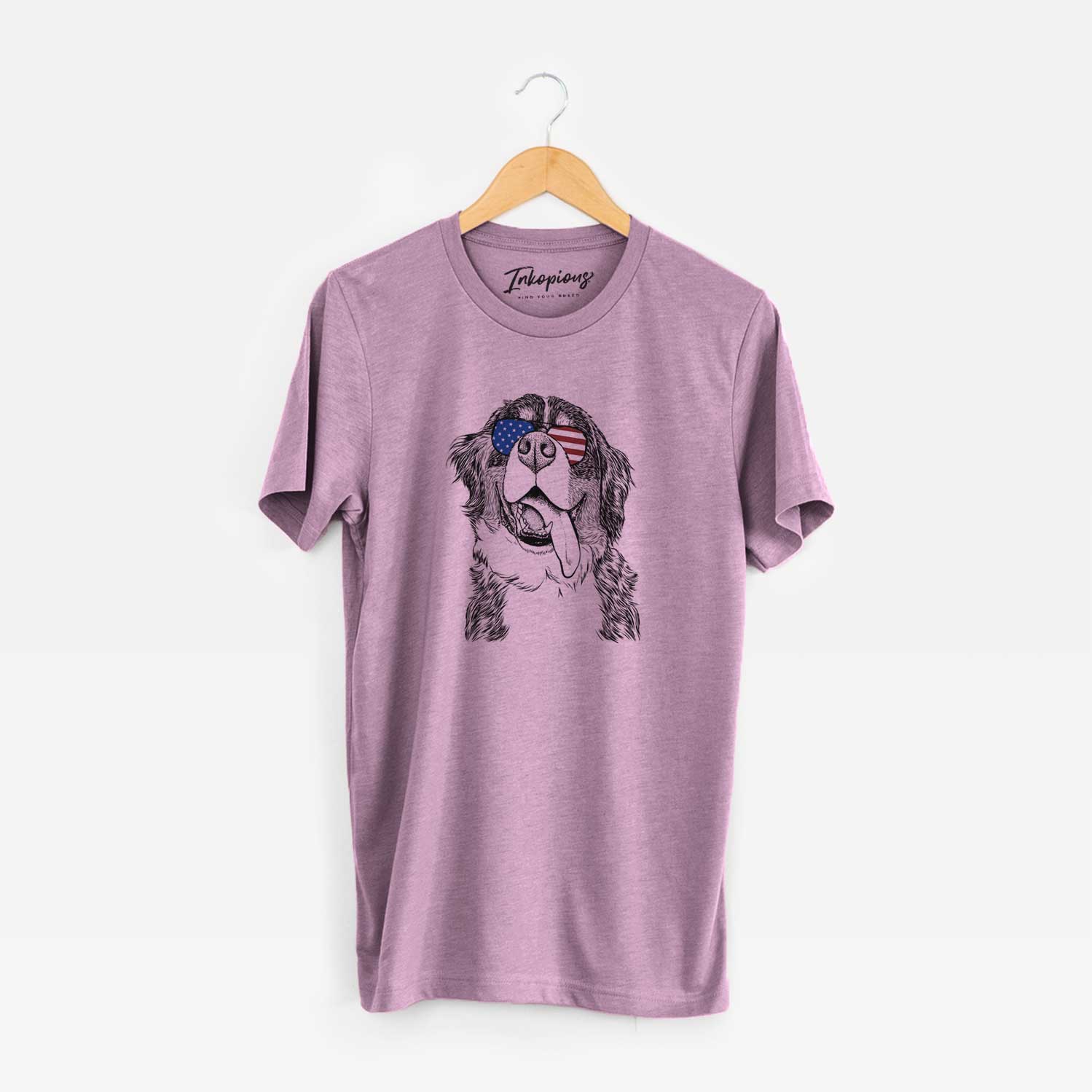 Hand-drawn sketch of Theo the Bernese Mountain Dog wearing American flag sunglasses on an Orchid Unisex crewneck