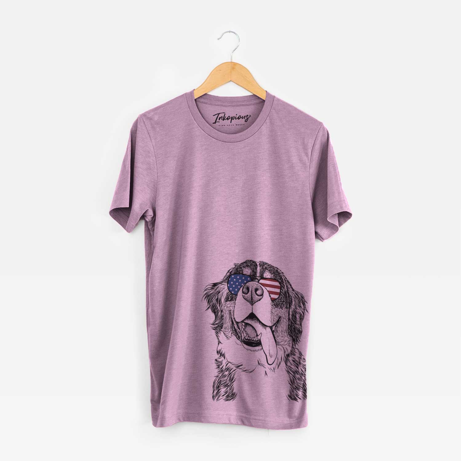 Hand-drawn sketch of Theo the Bernese Mountain Dog wearing American flag sunglasses on an Orchid Unisex crewneck