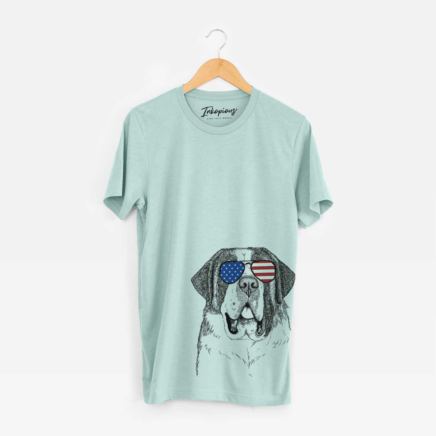Hand-drawn sketch of Thor the Saint Bernard wearing American flag sunglasses on a Heather Sage Unisex crewneck