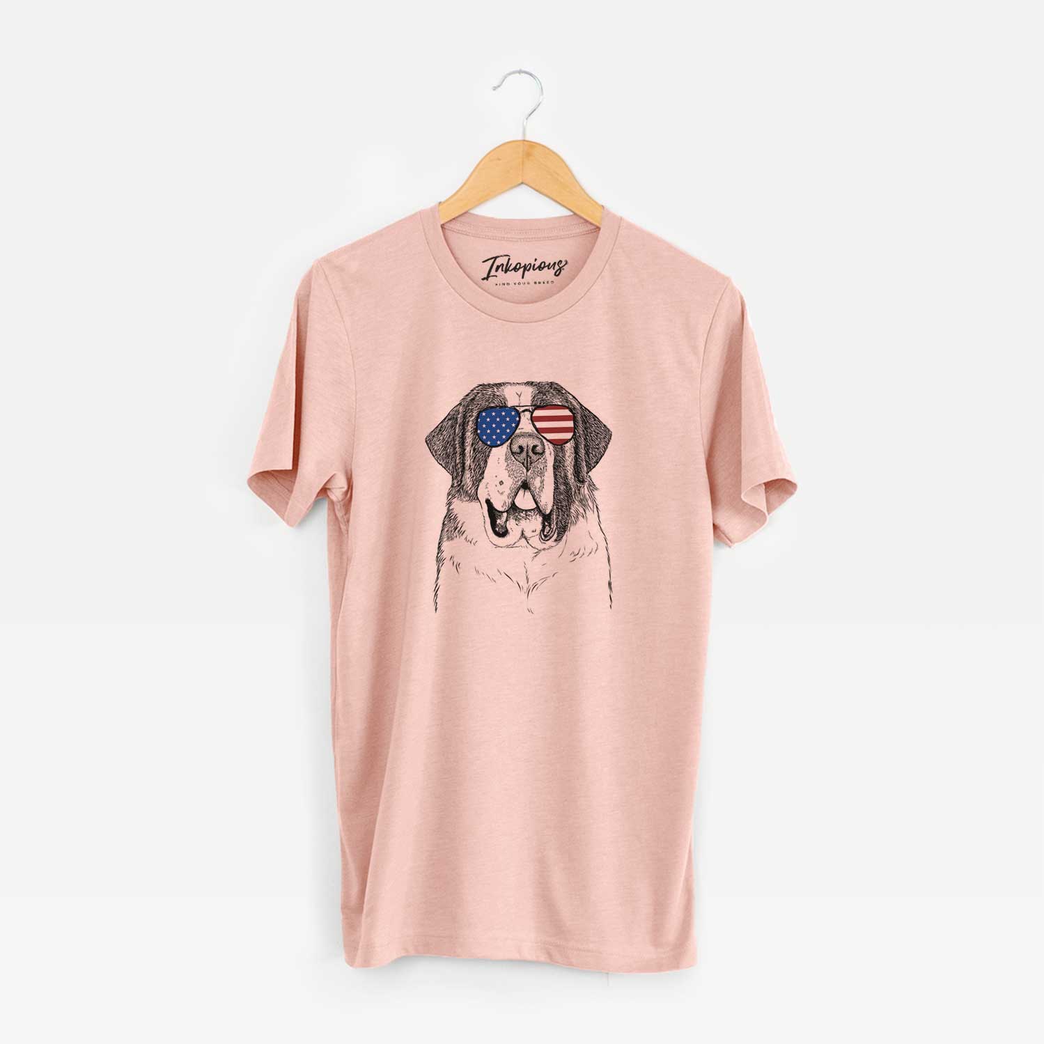 Hand-drawn sketch of Thor the Saint Bernard wearing American flag sunglasses on a Peach Unisex crewneck