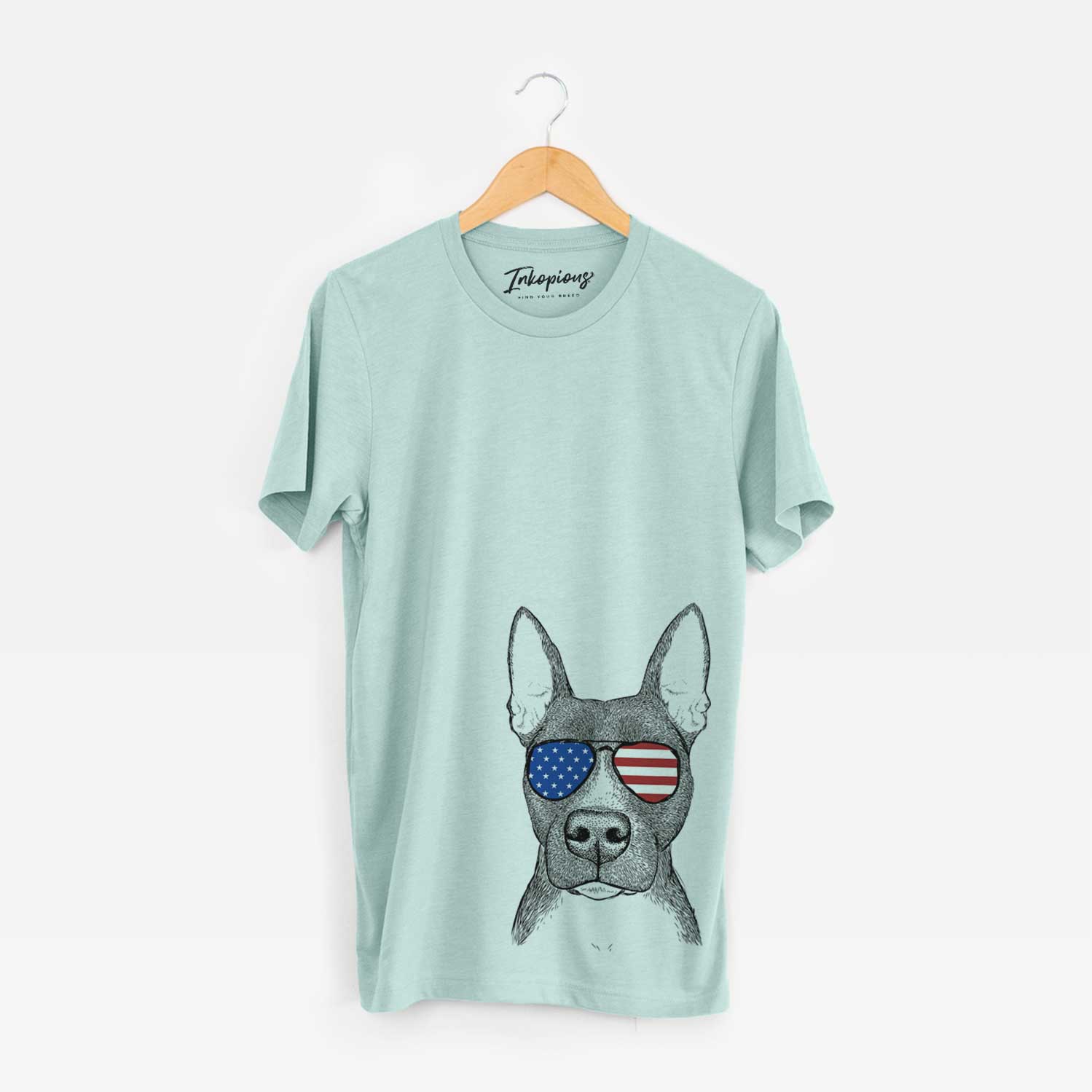 Hand-drawn sketch of Violet the Pitbull wearing American flag sunglasses on a Heather Sage Unisex crewneck