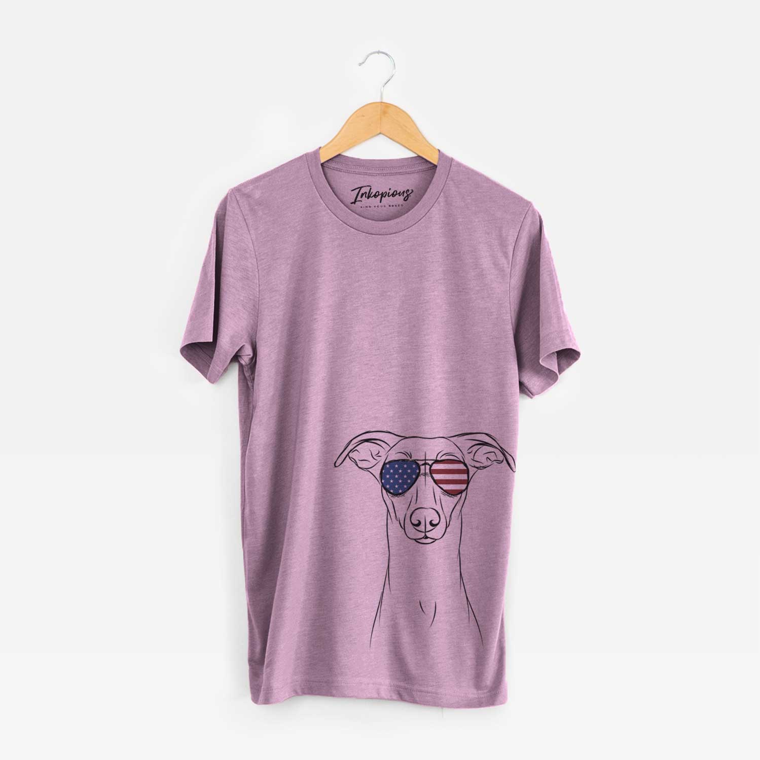 Hand-drawn sketch of Wallace the Whippet wearing American flag sunglasses on an Orchid Unisex crewneck
