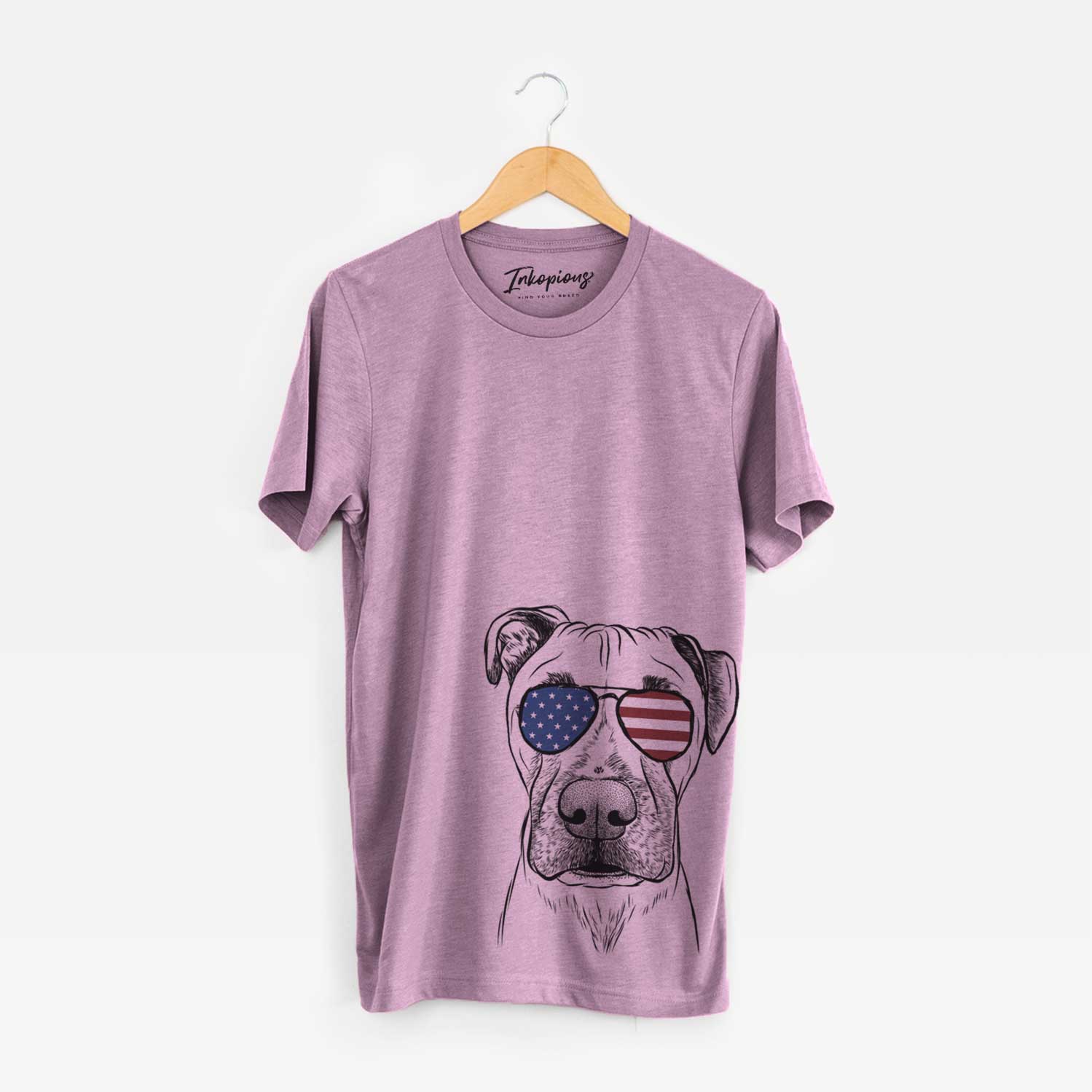 Hand-drawn sketch of Waylon the Boxane wearing American flag sunglasses on an Orchid Unisex crewneck