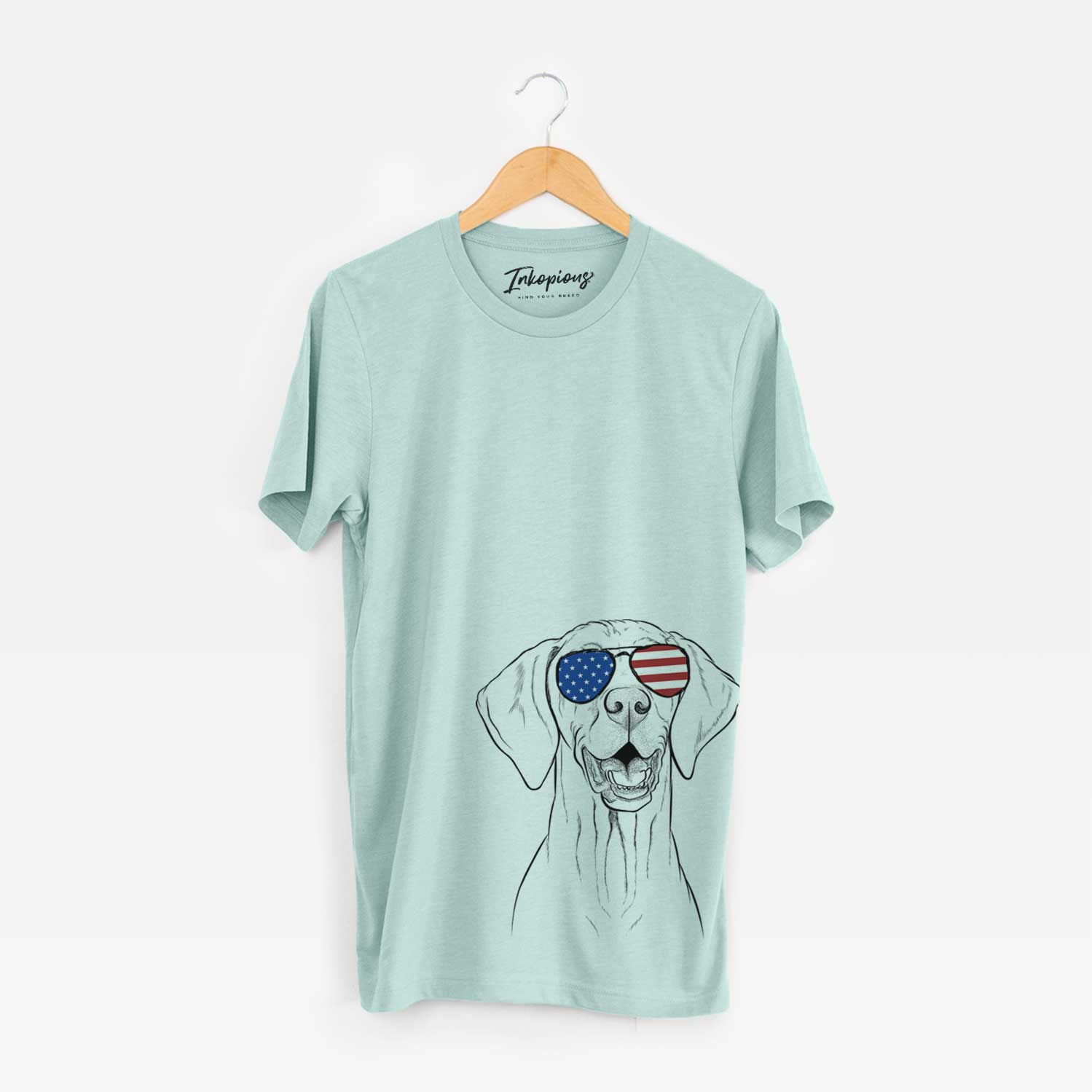 Hand-drawn sketch of Wesley the Vizsla wearing American flag sunglasses on a Heather Sage Unisex crewneck