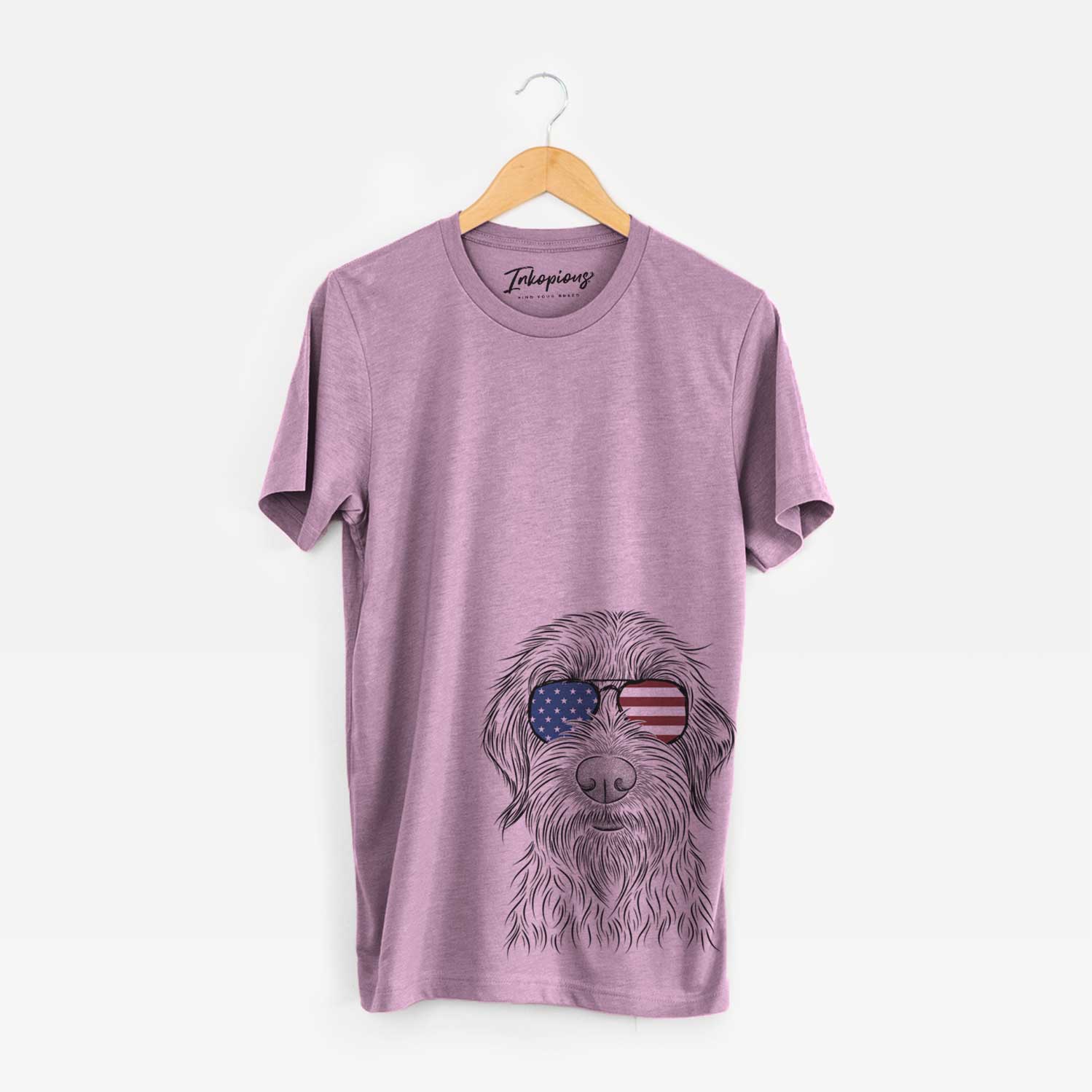 Hand-drawn sketch of Wilkins the Wirehaired Pointing Griffon wearing American flag sunglasses on an Orchid Unisex crewneck