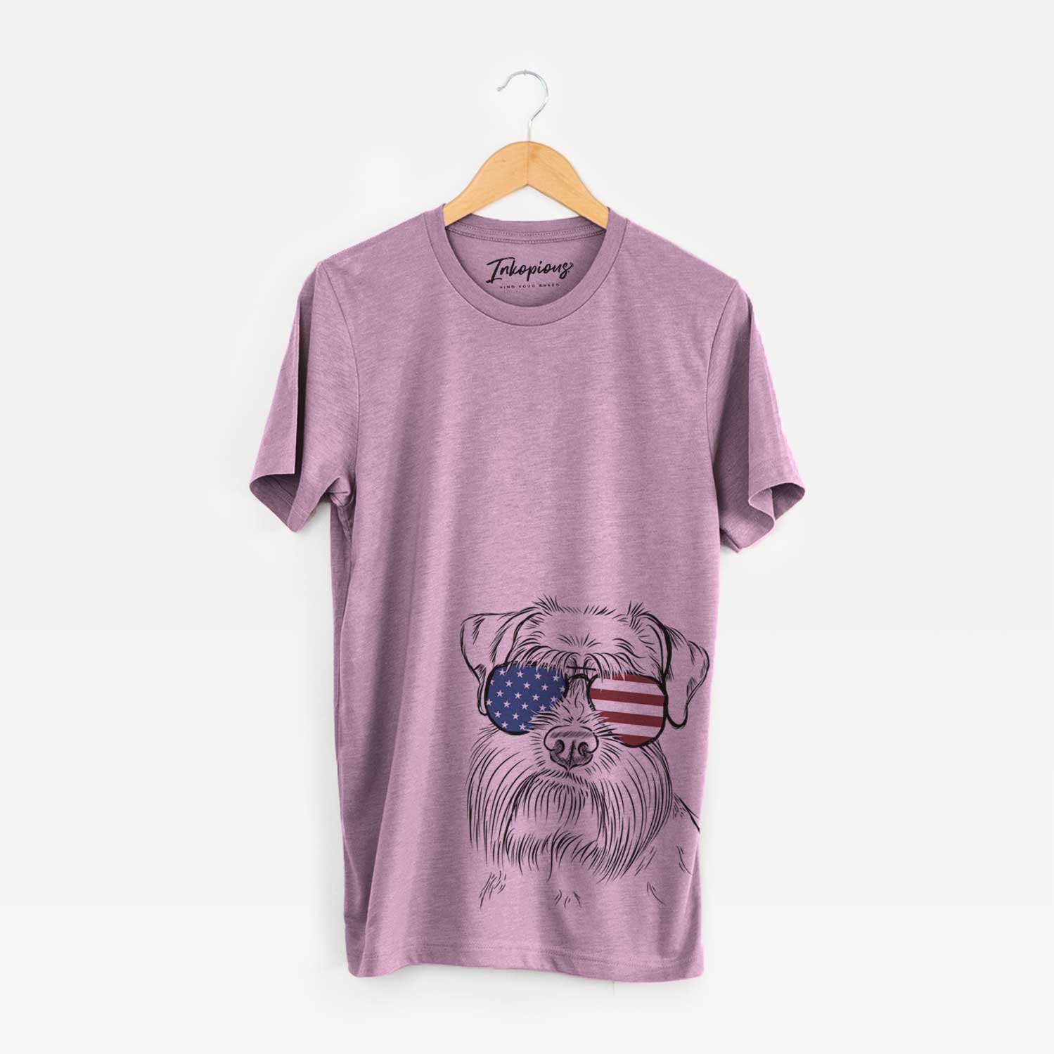 Hand-drawn sketch of Wrigley the Schnauzer wearing American flag sunglasses on an Orchid Unisex crewneck
