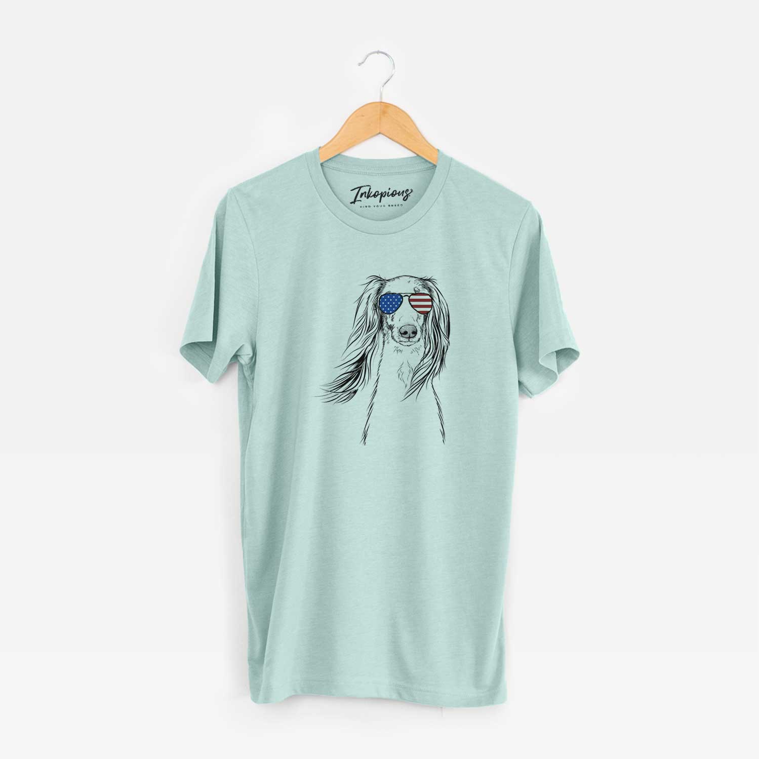 Hand-drawn sketch of Zahra the Saluki wearing American flag sunglasses on a Heather Sage Unisex crewneck