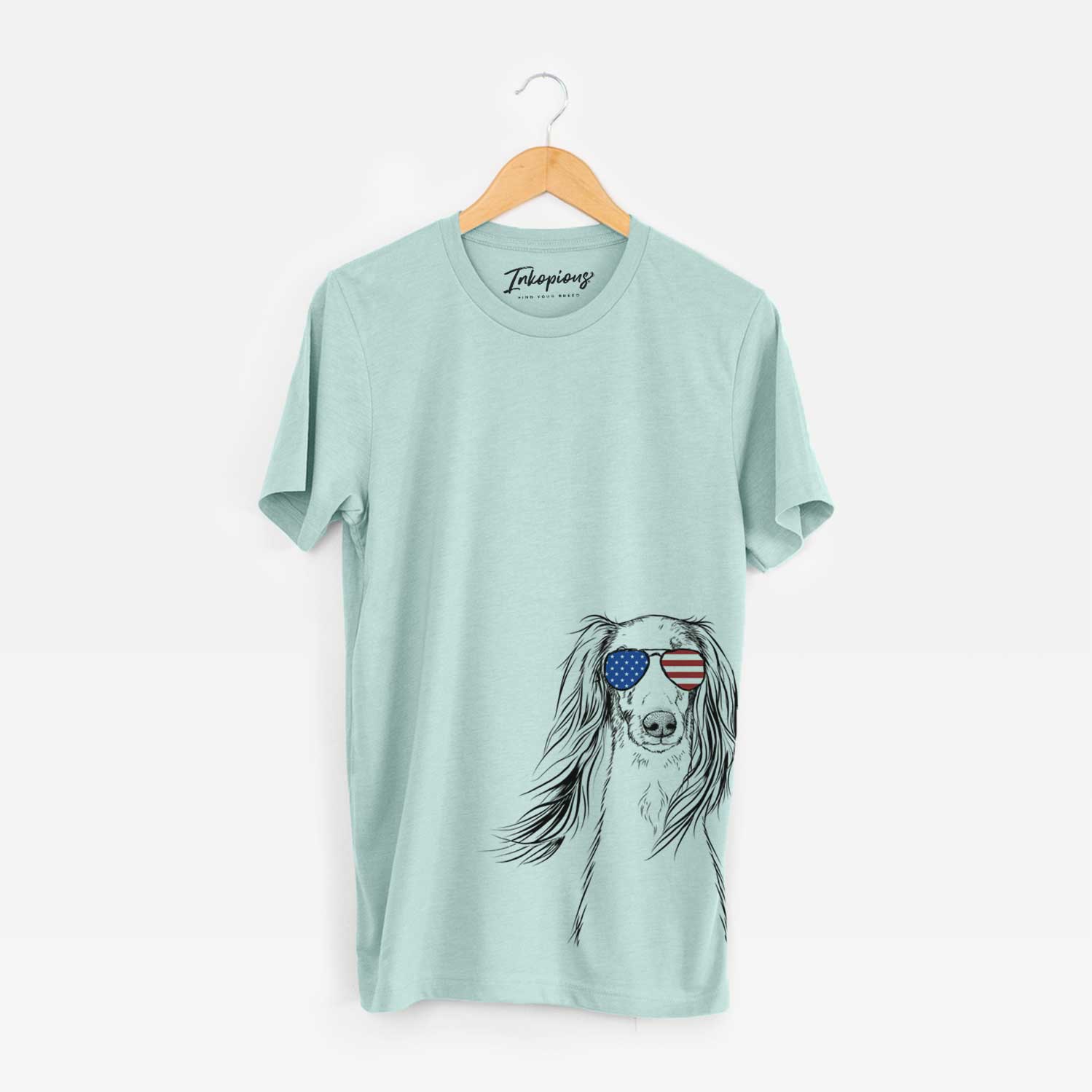 Hand-drawn sketch of Zahra the Saluki wearing American flag sunglasses on a Heather Sage Unisex crewneck