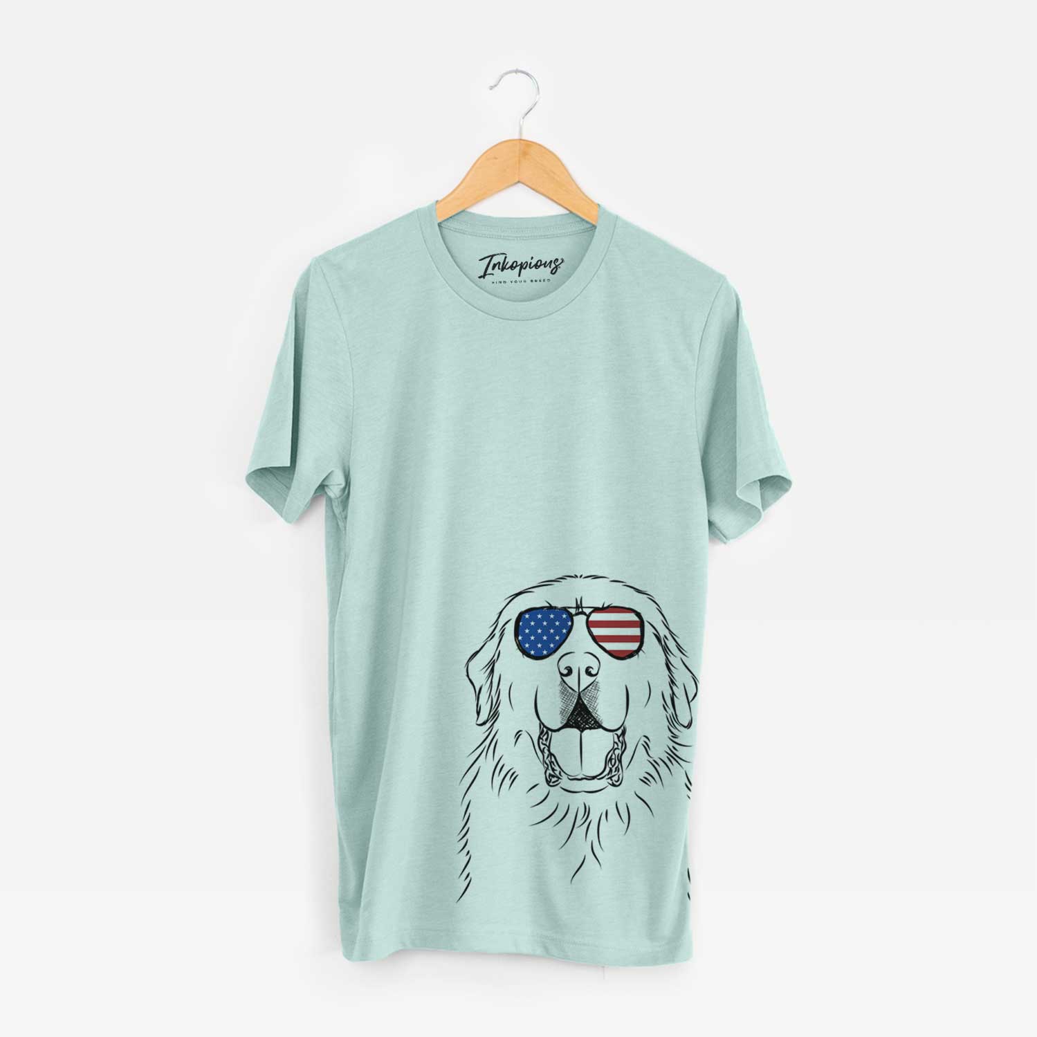 Hand-drawn sketch of Zeus the Great Pyrenees wearing American flag sunglasses on a Heather Sage Unisex crewneck