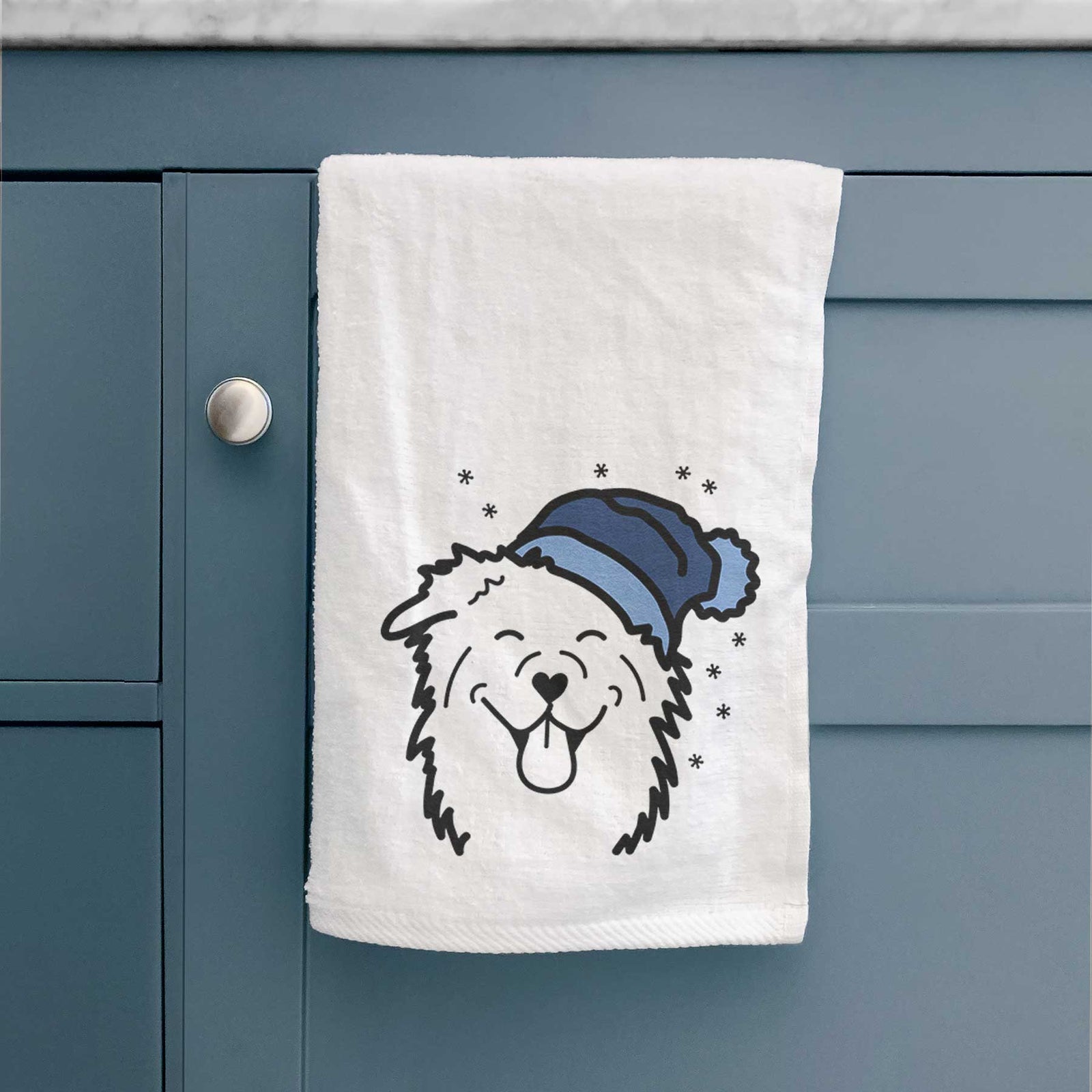Minimalist line drawing of an Australian Shepherd wearing a winter beanie on a decorative hand towel