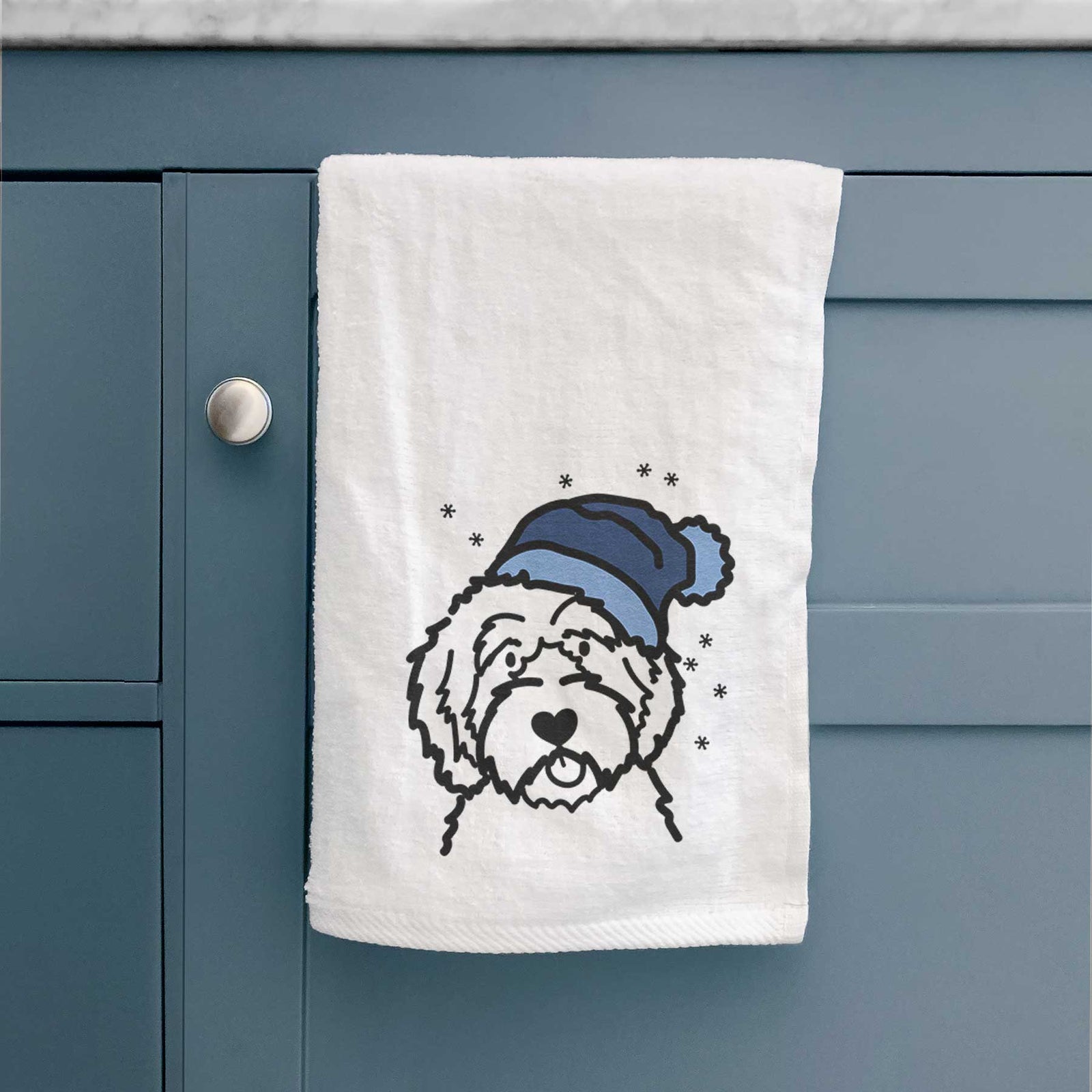 Minimalist line drawing of an Aussiedoodle wearing a winter beanie on a decorative hand towel