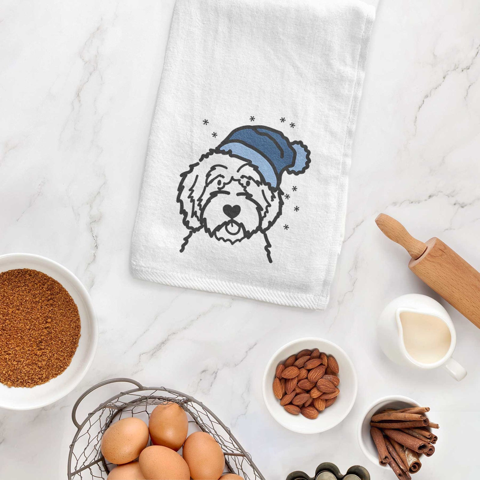 Minimalist line drawing of an Aussiedoodle wearing a winter beanie on a decorative hand towel