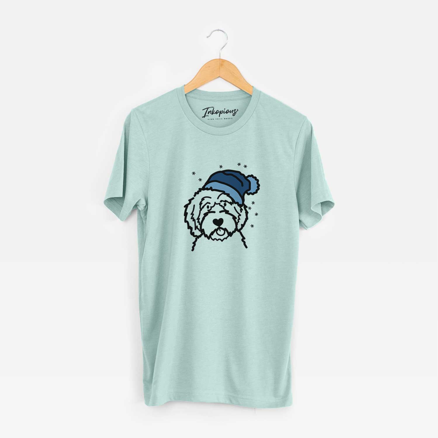 Minimalist line drawing of an Aussiedoodle wearing a winter beanie on a Heather Sage Unisex crewneck