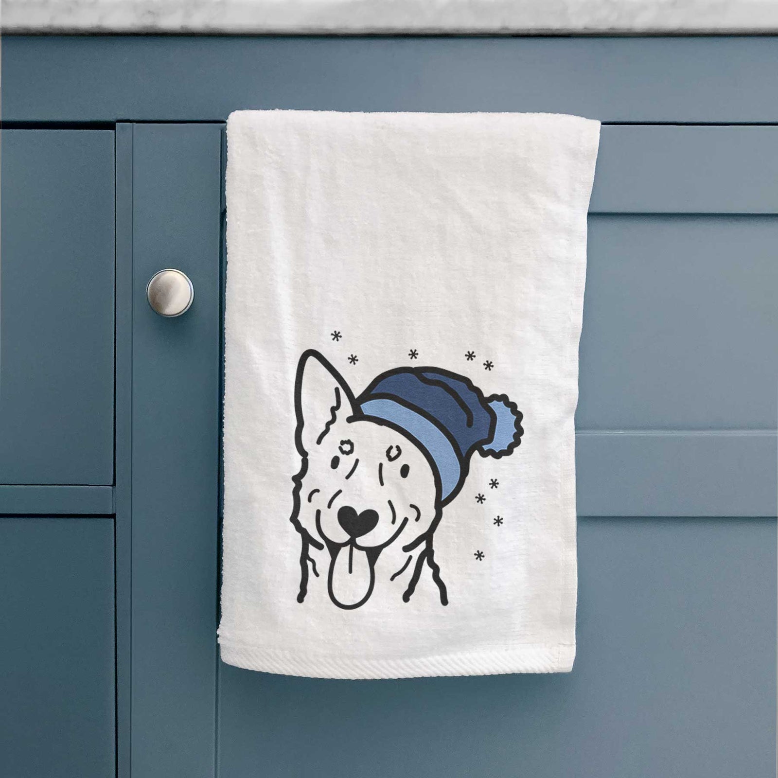 Minimalist line drawing of an Australian Cattle Dog wearing a winter beanie on a decorative hand towel