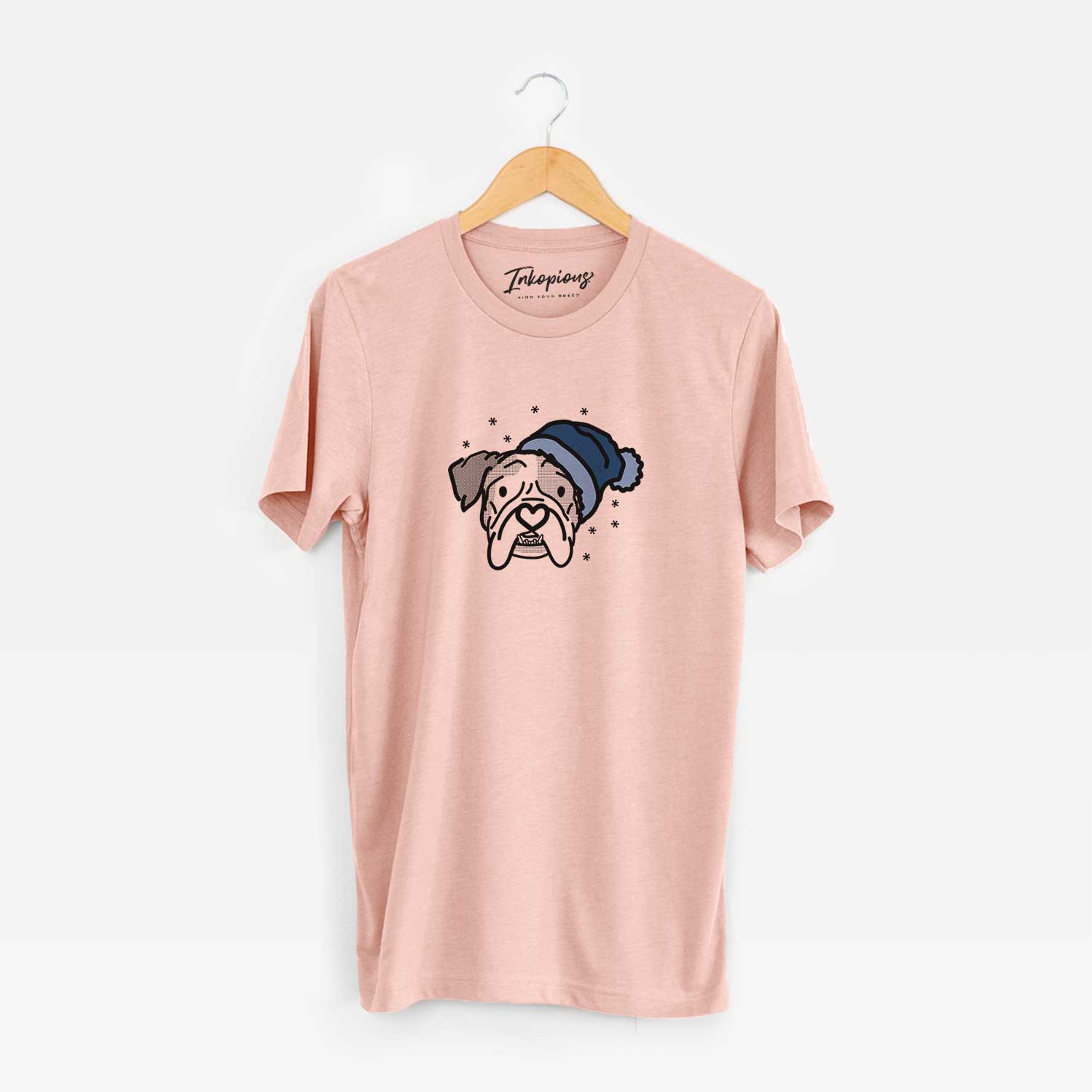 Minimalist line drawing of Bailey the English Bulldog wearing a winter beanie on a Peach Unisex crewneck
