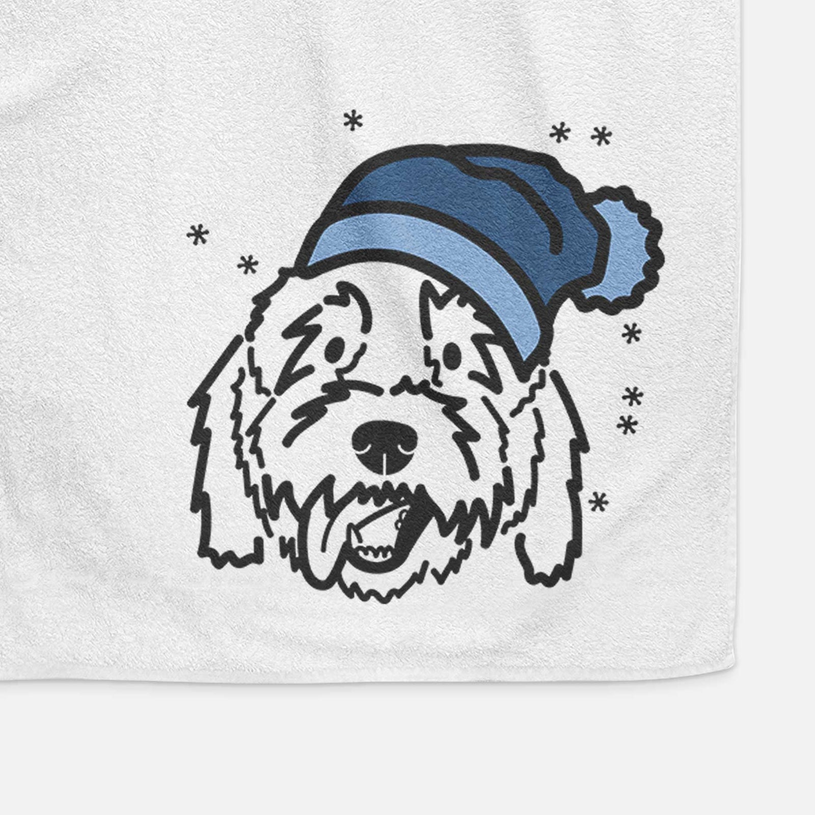 Minimalist line drawing of Barry the Goldendoodle wearing a winter beanie on a decorative hand towel