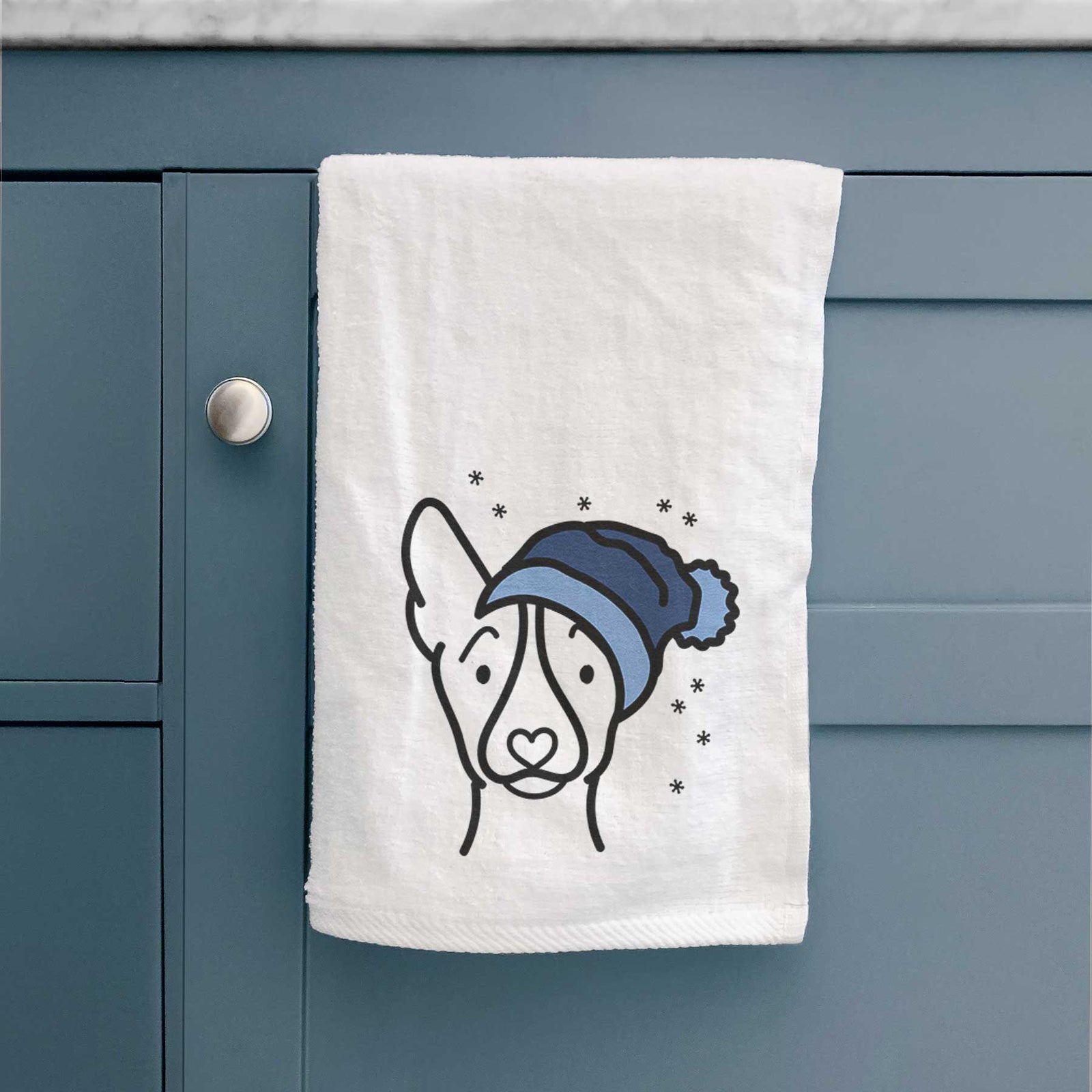 Minimalist line drawing of a Basenji wearing a winter beanie on a decorative hand towel