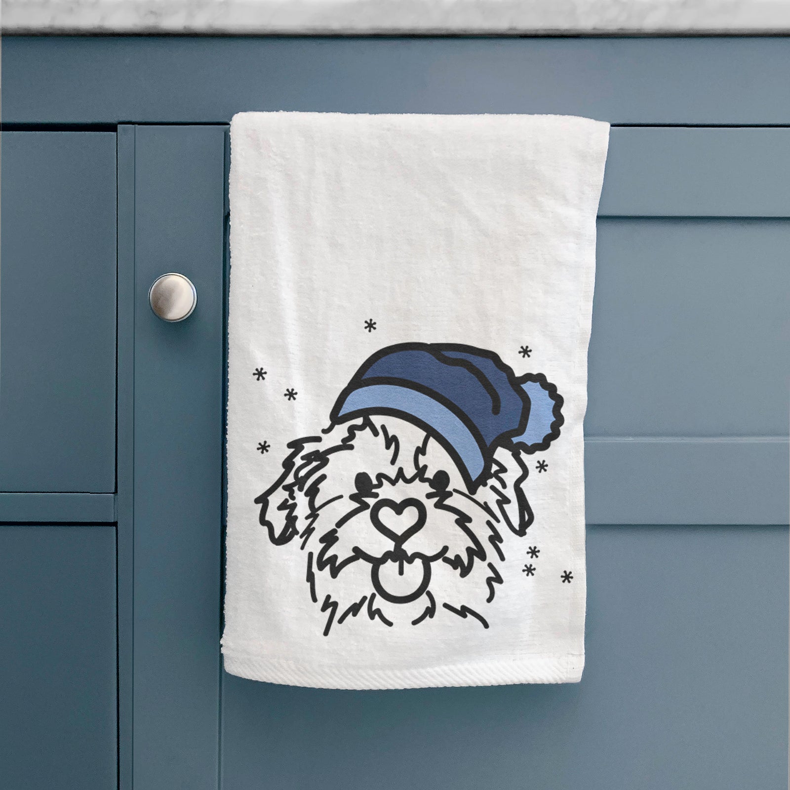 Minimalist line drawing of Bea the Mixed Breed wearing a winter beanie on a decorative hand towel