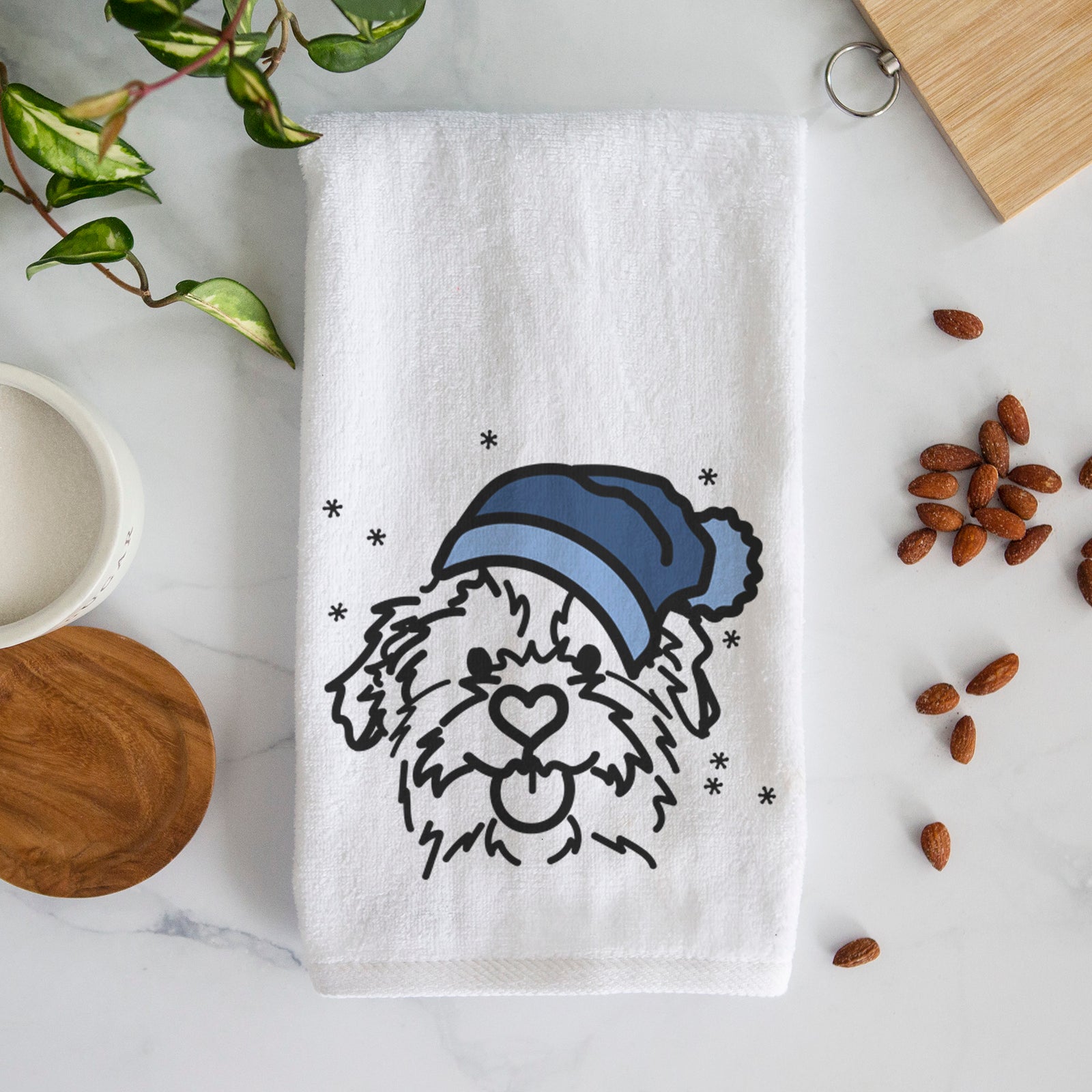 Minimalist line drawing of Bea the Mixed Breed wearing a winter beanie on a decorative hand towel