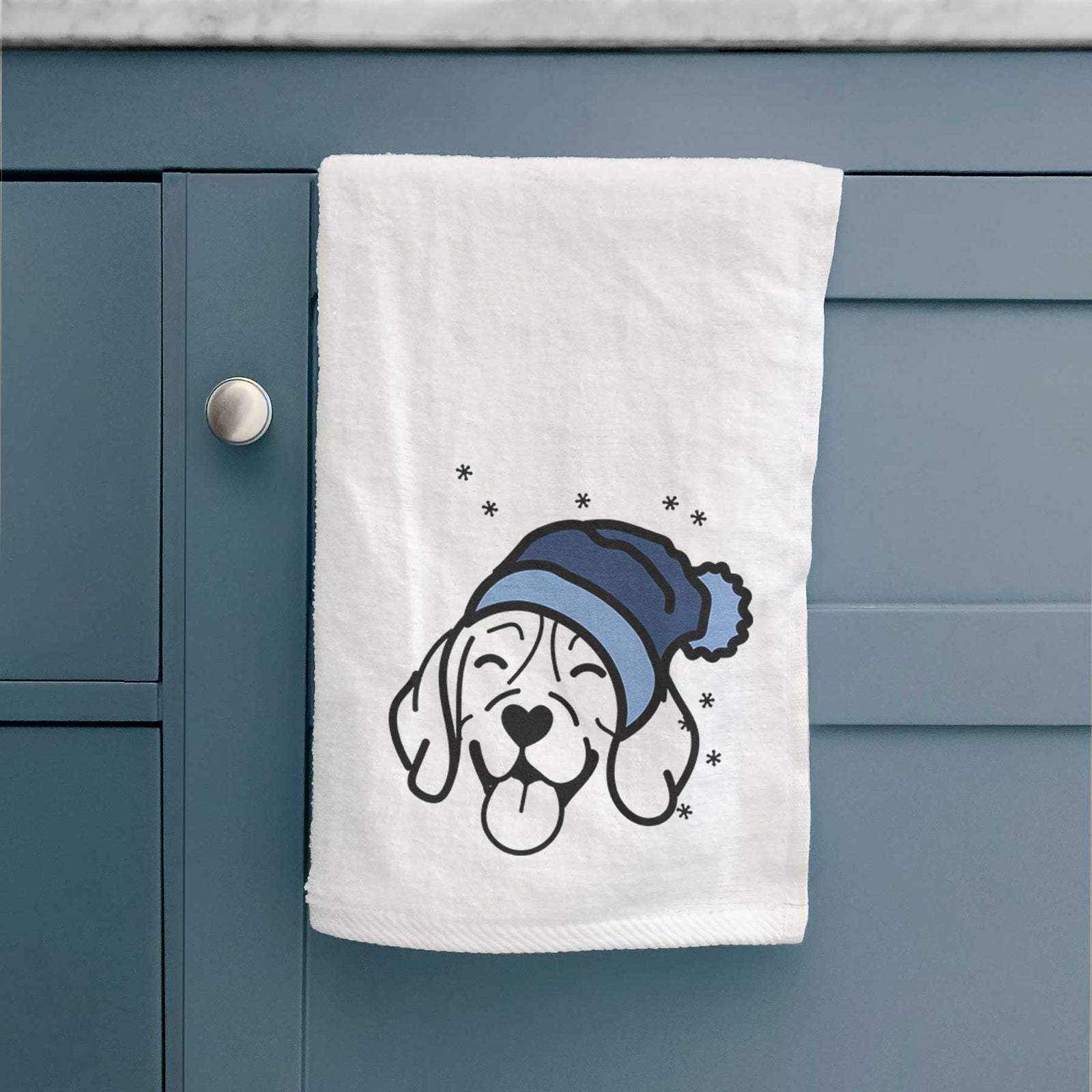 Minimalist line drawing of a Beagle wearing a winter beanie on a decorative hand towel