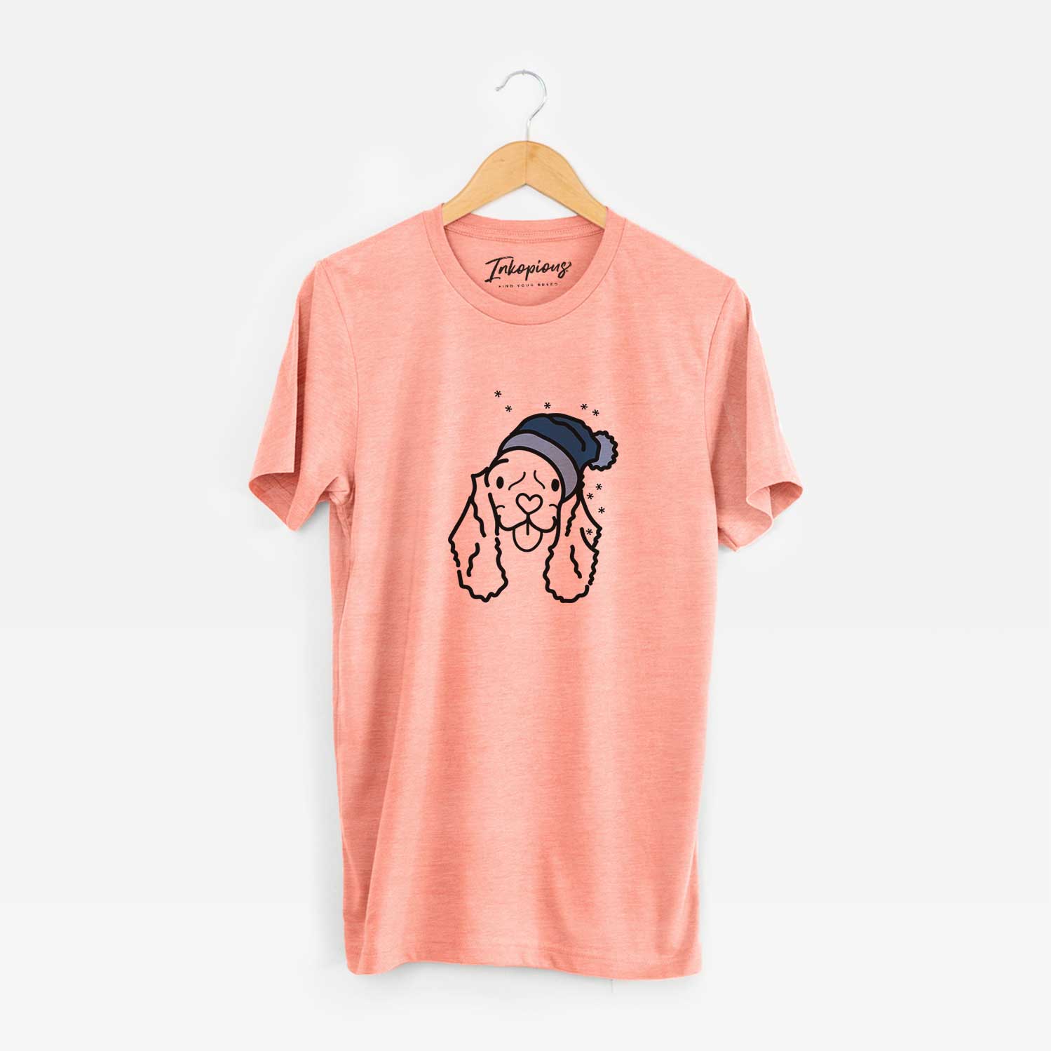 Minimalist line drawing of Bella the American Cocker Spaniel wearing a winter beanie on a Sunset Unisex crewneck