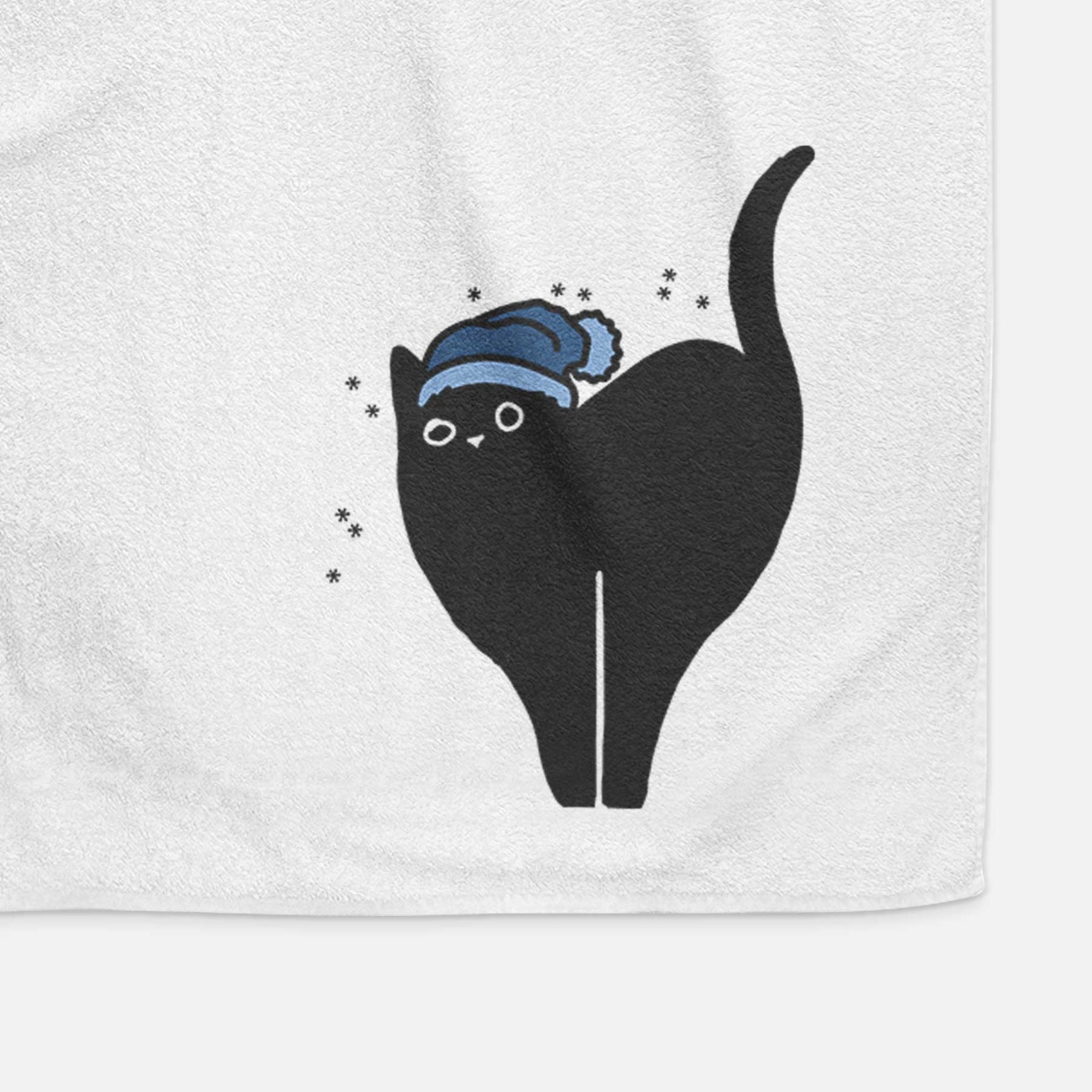 Minimalist line drawing of Bella the Black Cat wearing a winter beanie on a decorative hand towel