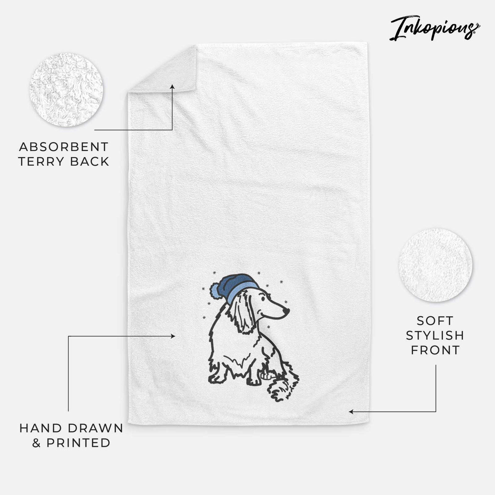 Minimalist line drawing of Bella the Dachshund wearing a winter beanie on a decorative hand towel