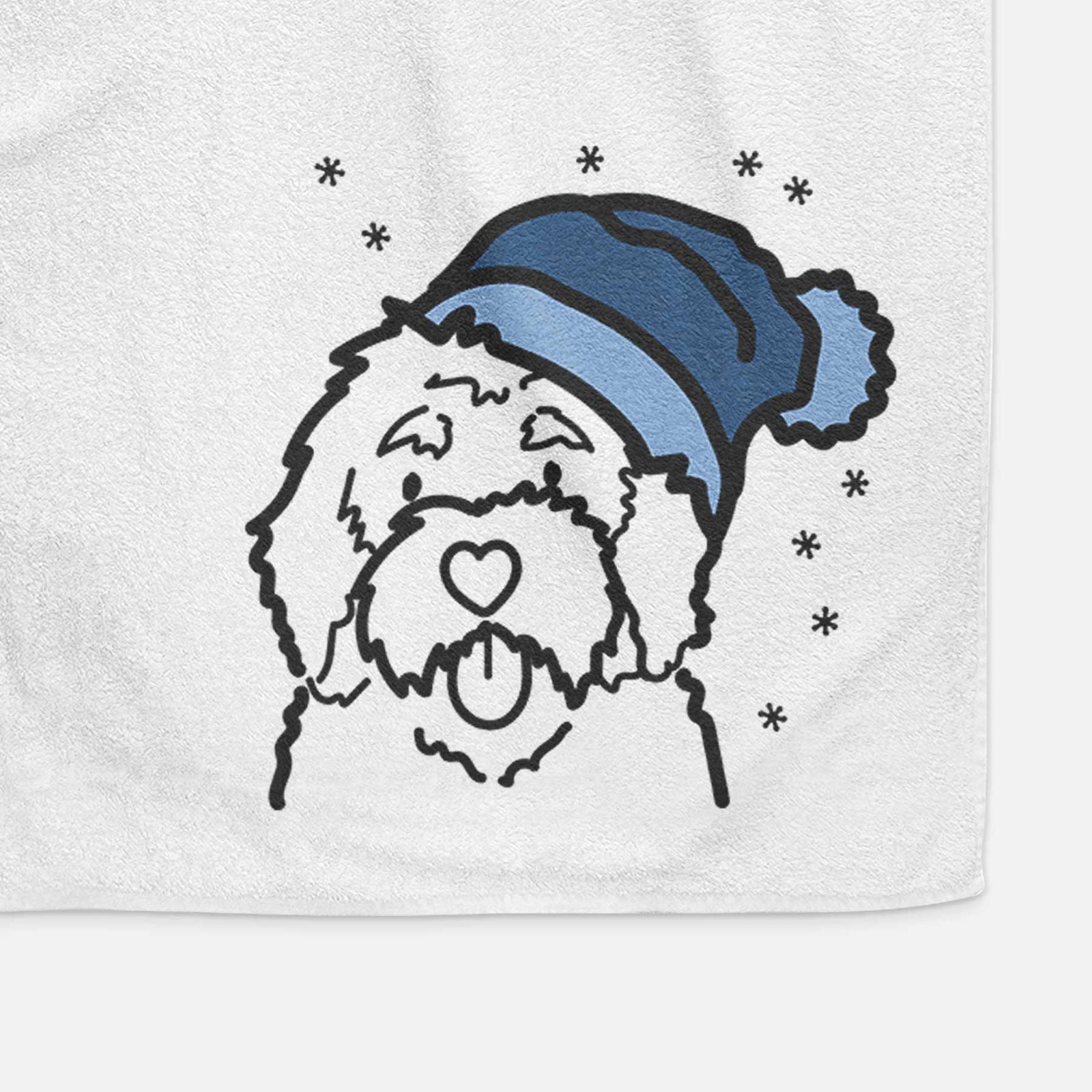 Minimalist line drawing of a Bernedoodle wearing a winter beanie on a decorative hand towel