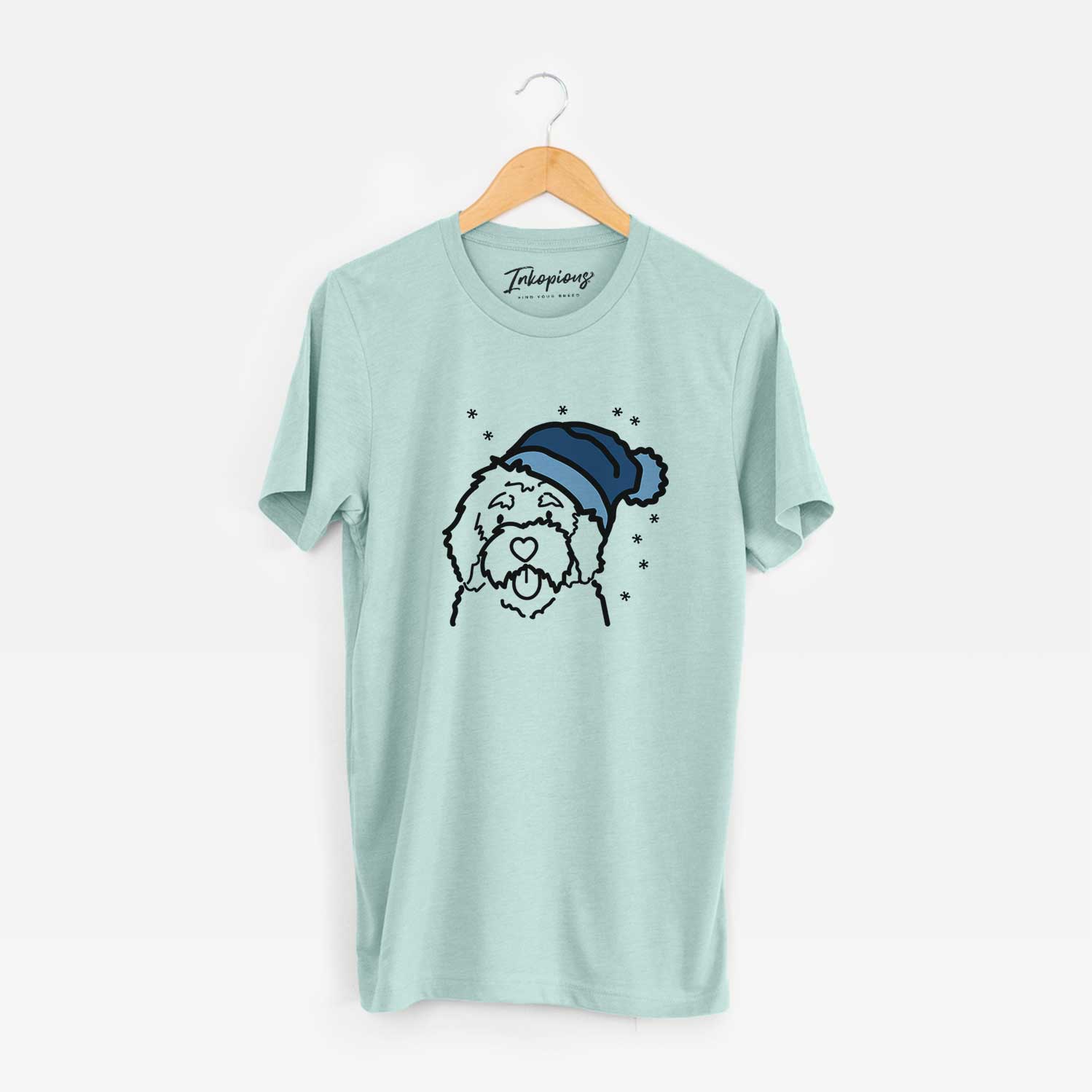 Minimalist line drawing of a Bernedoodle wearing a winter beanie on a Heather Sage Unisex crewneck