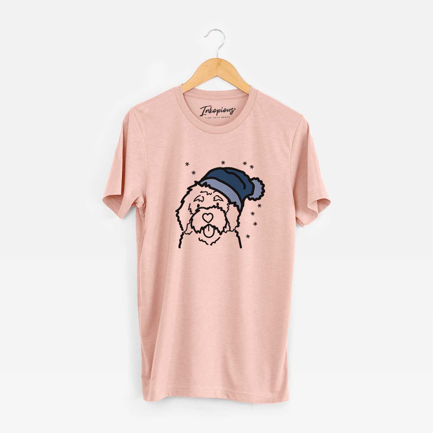 Minimalist line drawing of a Bernedoodle wearing a winter beanie on a Peach Unisex crewneck