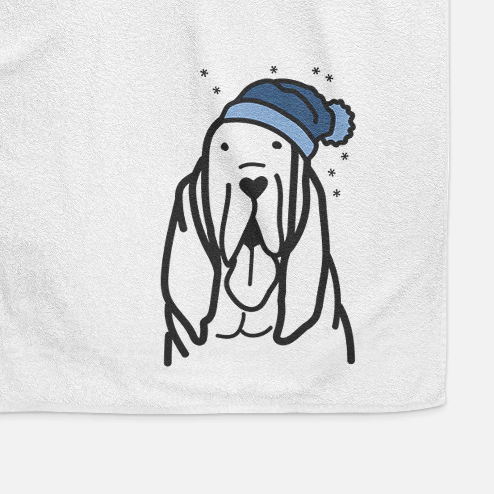 Minimalist line drawing of a Bloodhound wearing a winter beanie on a decorative hand towel
