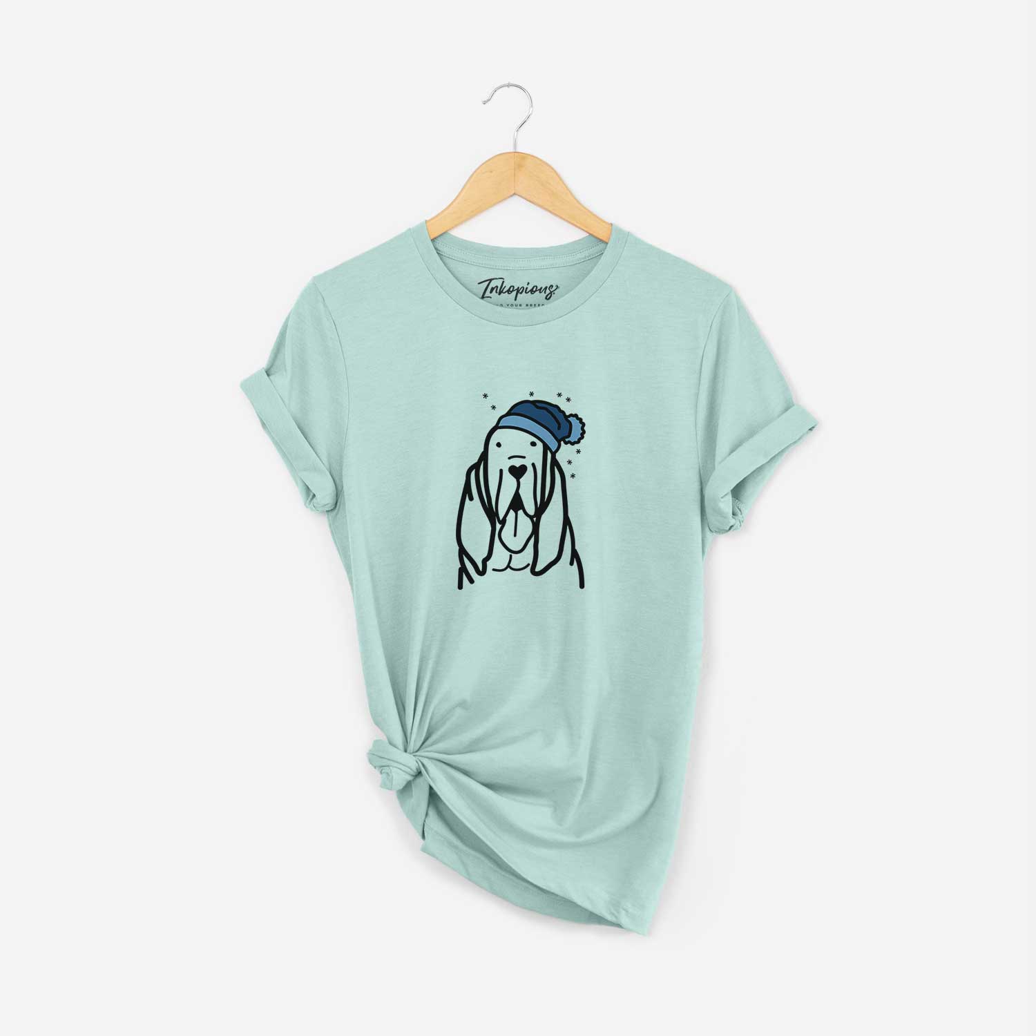 Minimalist line drawing of a Bloodhound wearing a winter beanie on a Heather Sage Unisex crewneck