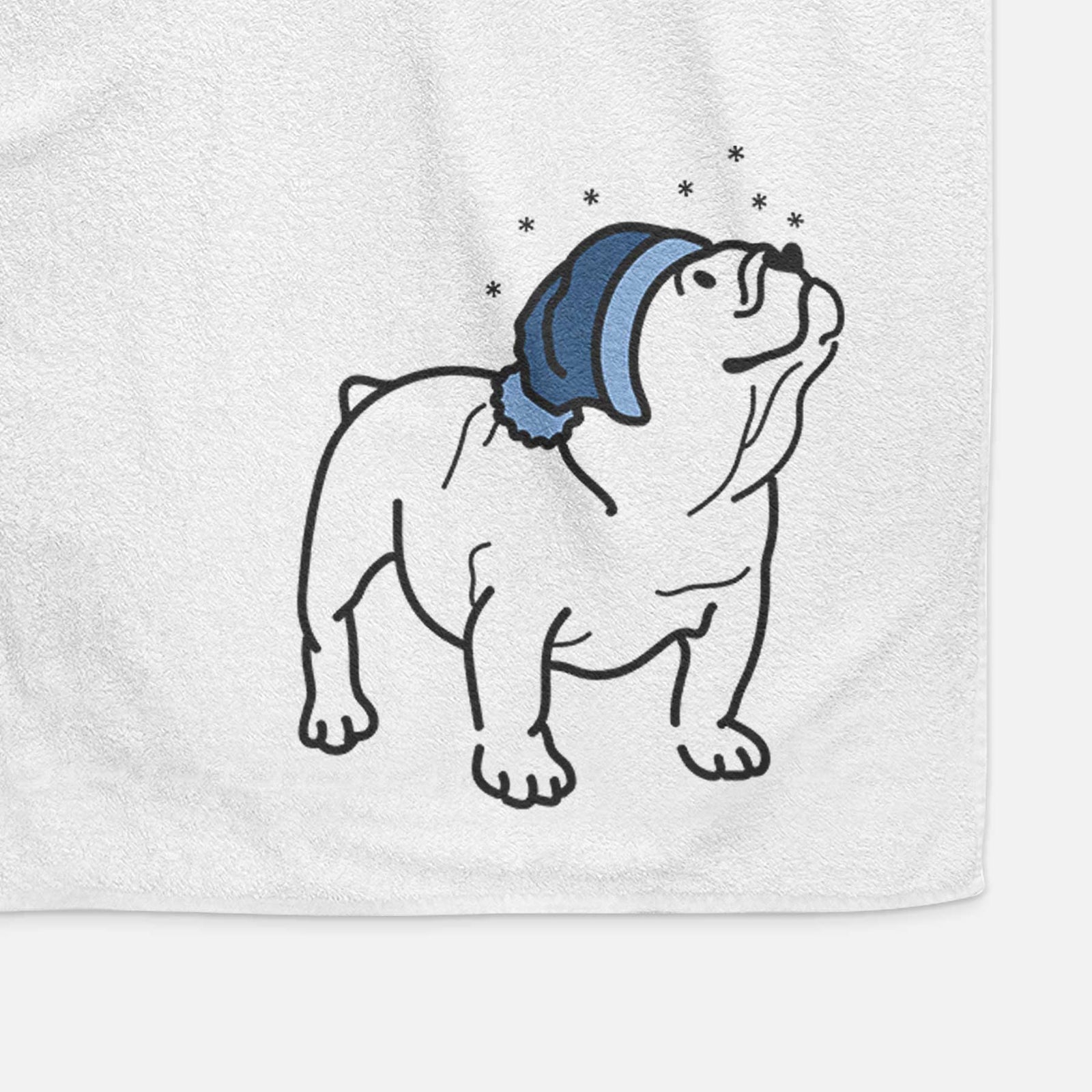 Minimalist line drawing of Bruno the English Bulldog wearing a winter beanie on a decorative hand towel
