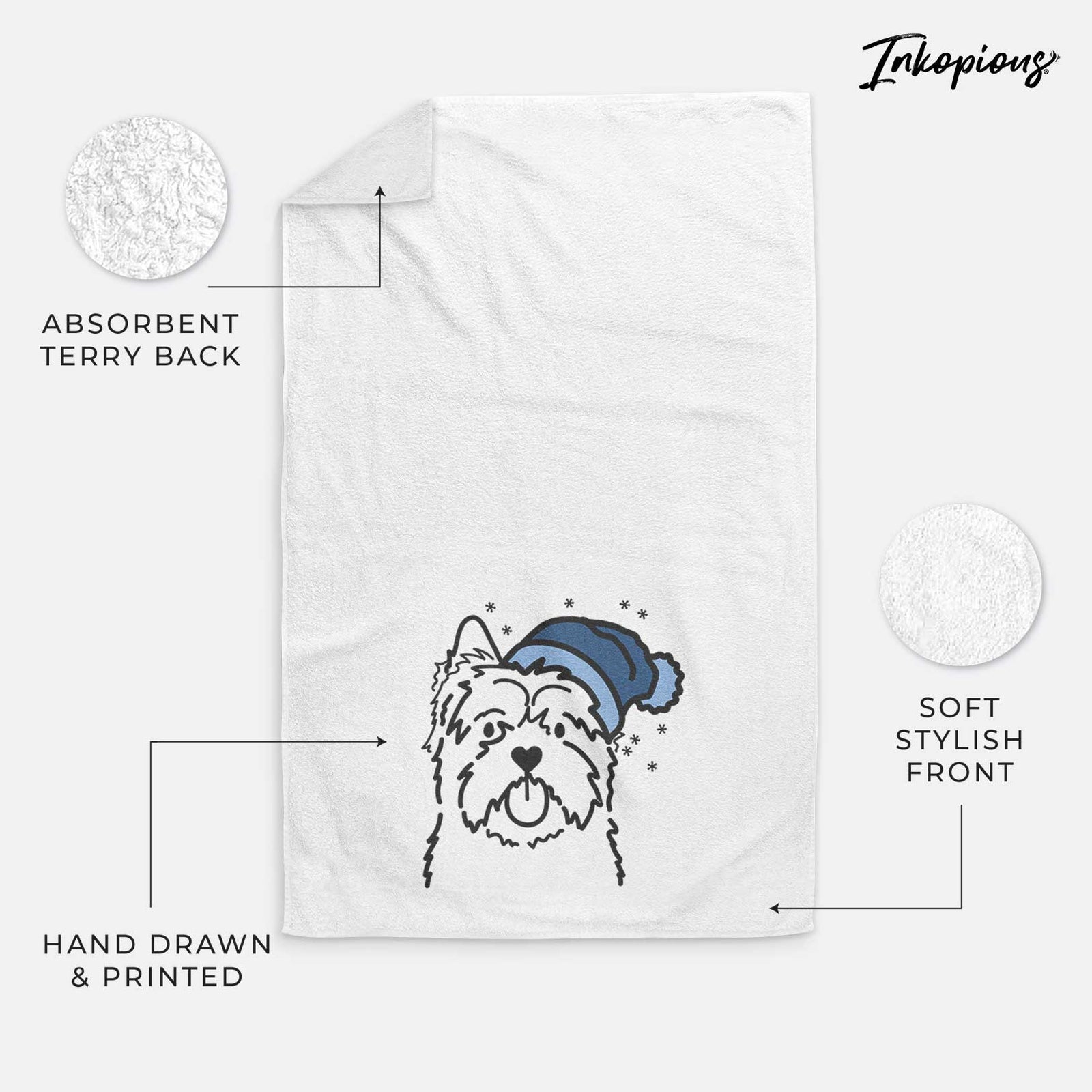 Minimalist line drawing of a Cairn Terrier wearing a winter beanie on a decorative hand towel