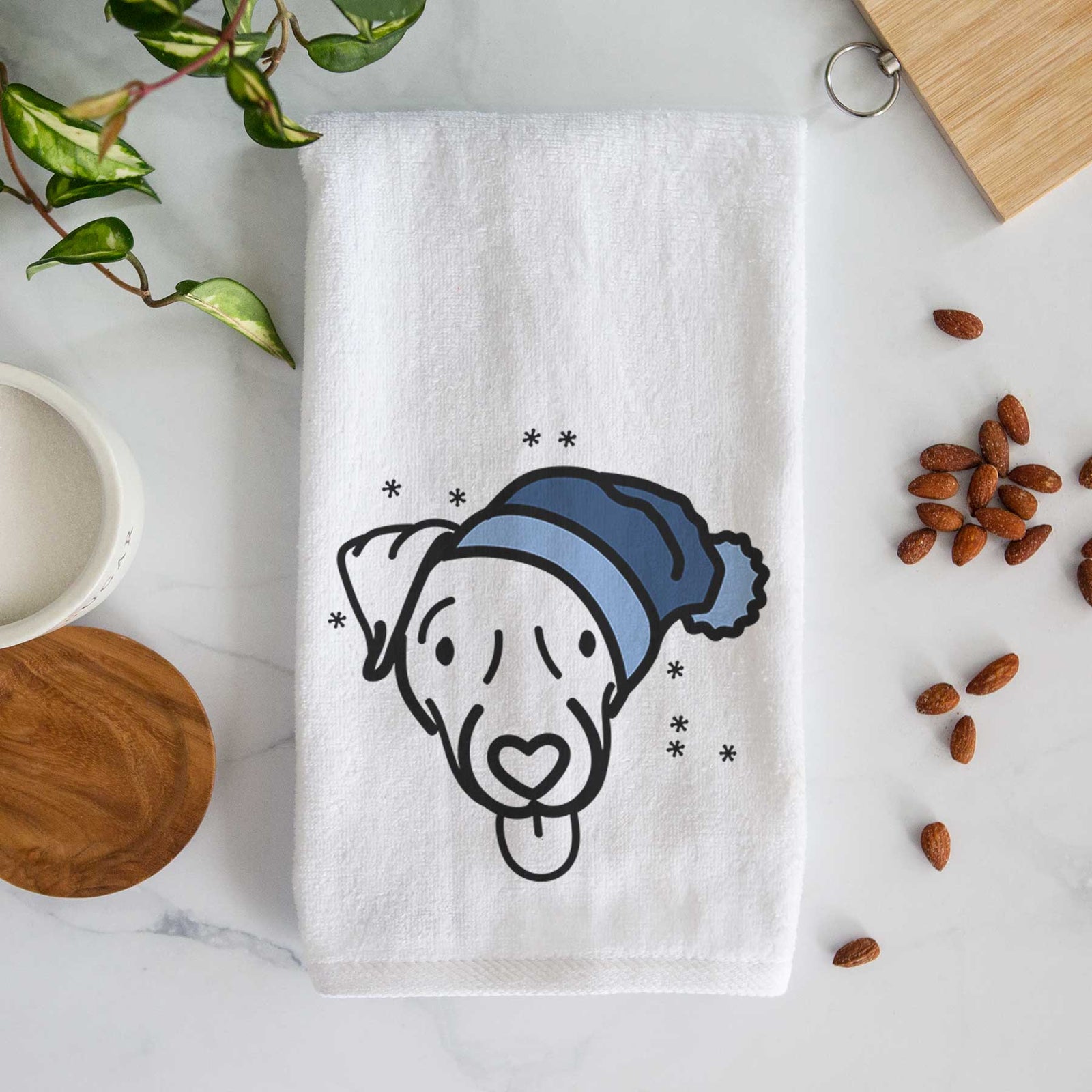 Minimalist line drawing of Cammy the Jack Russell Terrier wearing a winter beanie on a decorative hand towel