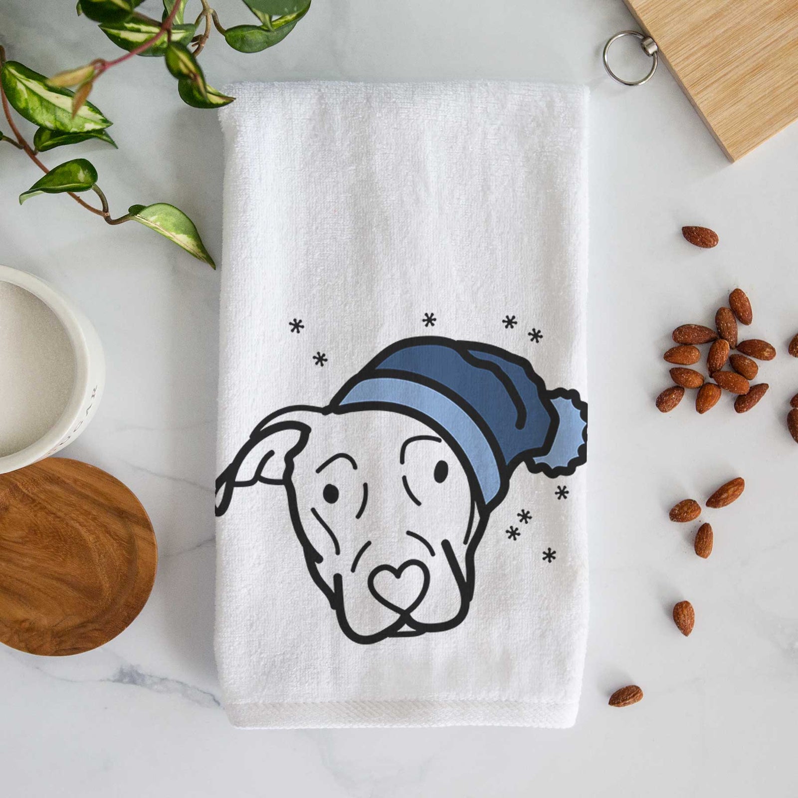 Minimalist line drawing of a Catahoula wearing a winter beanie on a decorative hand towel