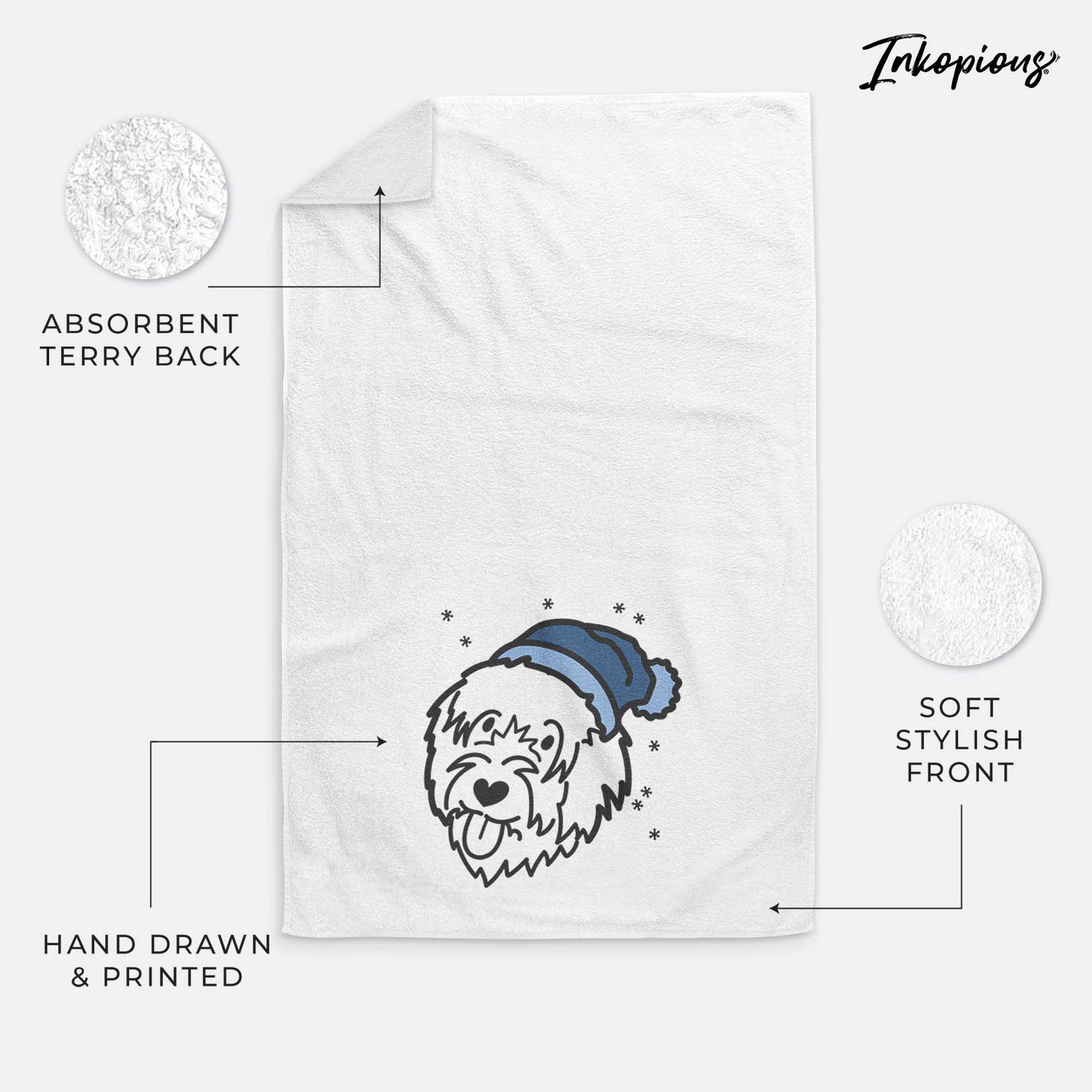 Minimalist line drawing of a Catalan Sheepdog wearing a winter beanie on a decorative hand towel