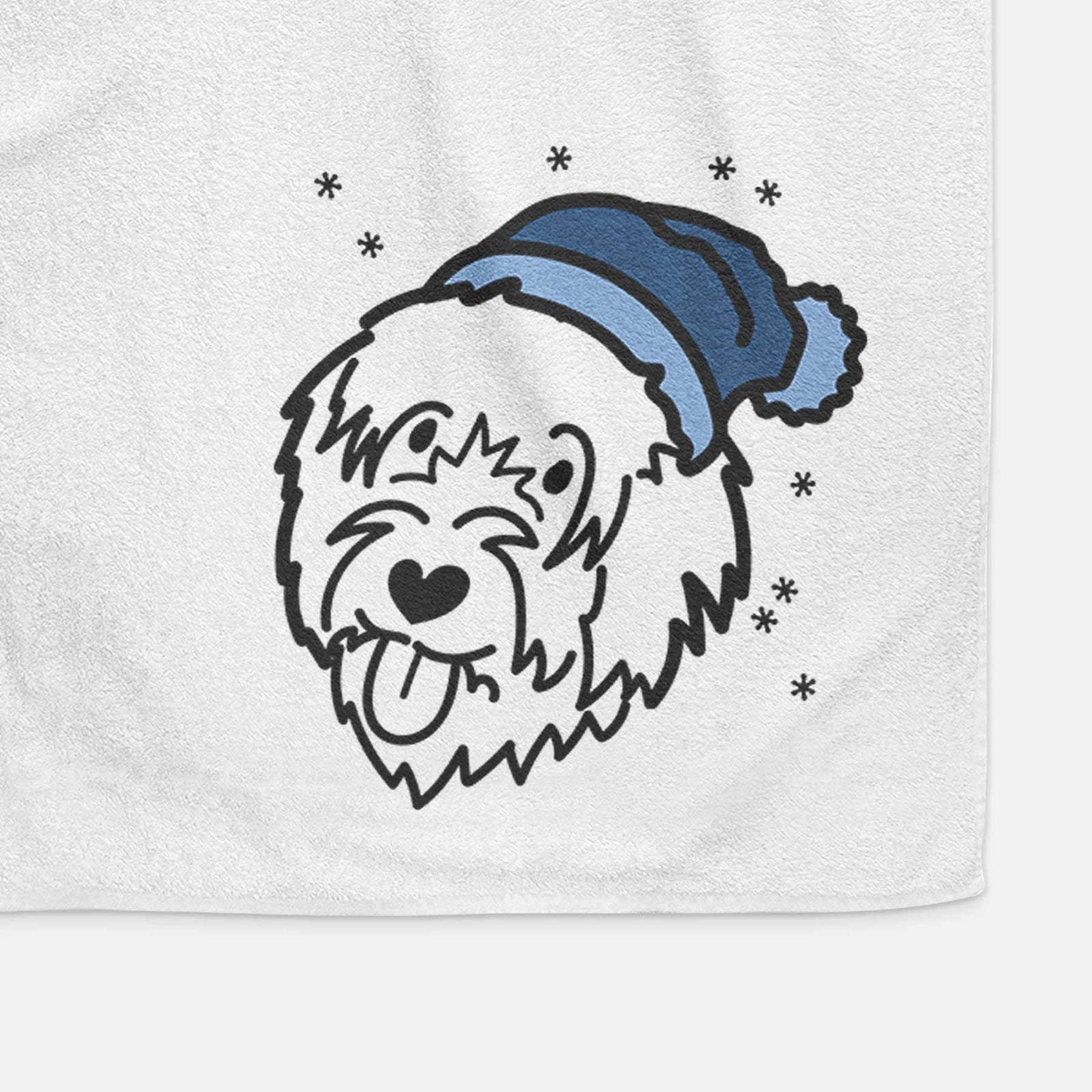 Minimalist line drawing of a Catalan Sheepdog wearing a winter beanie on a decorative hand towel