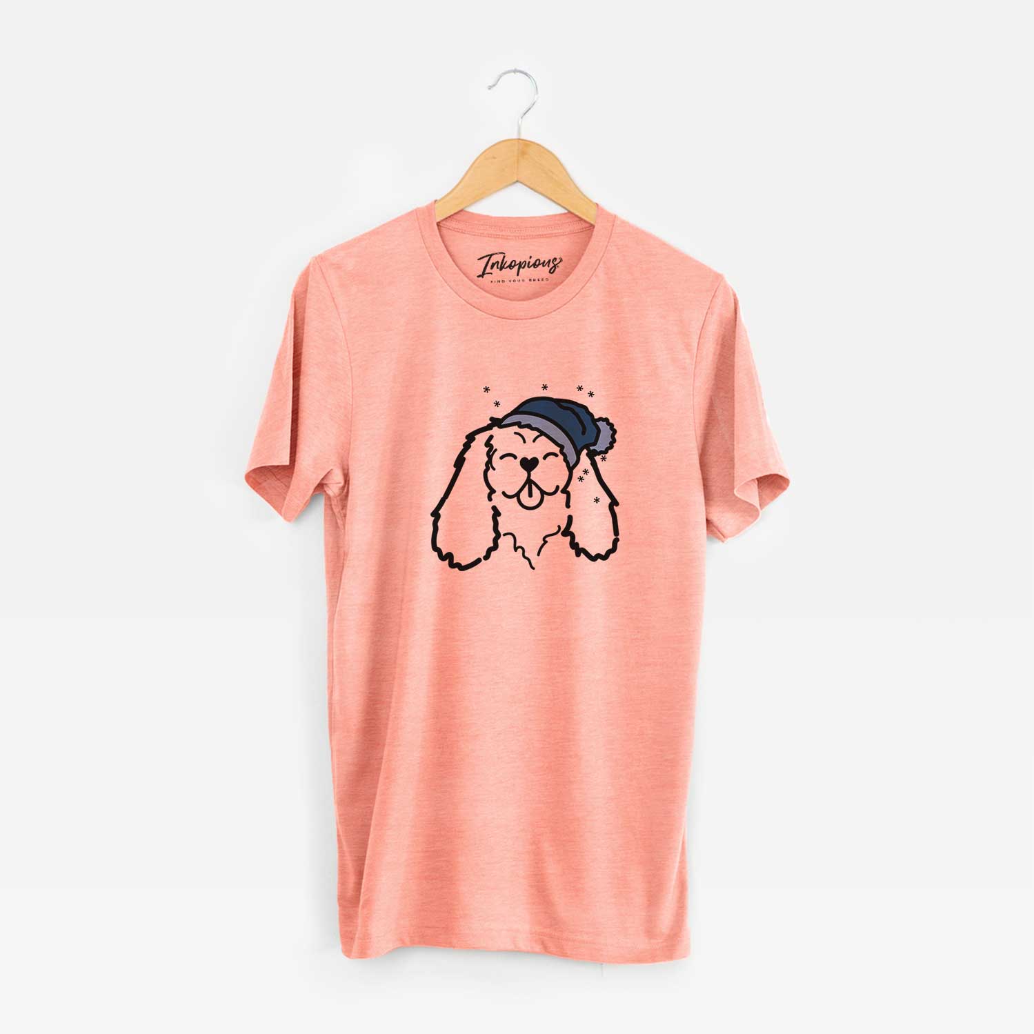 Minimalist line drawing of a Cavalier King Charles Spaniel wearing a winter beanie on a Sunset Unisex crewneck