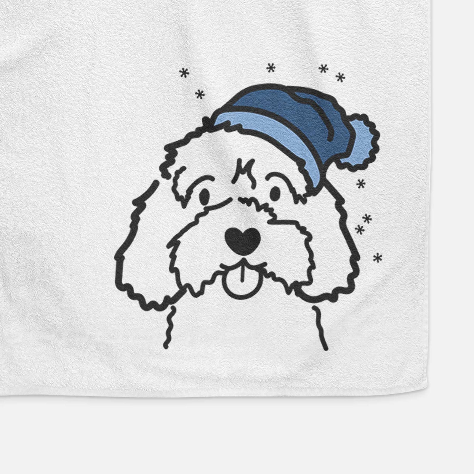 Minimalist line drawing of a Cavapoo wearing a winter beanie on a decorative hand towel