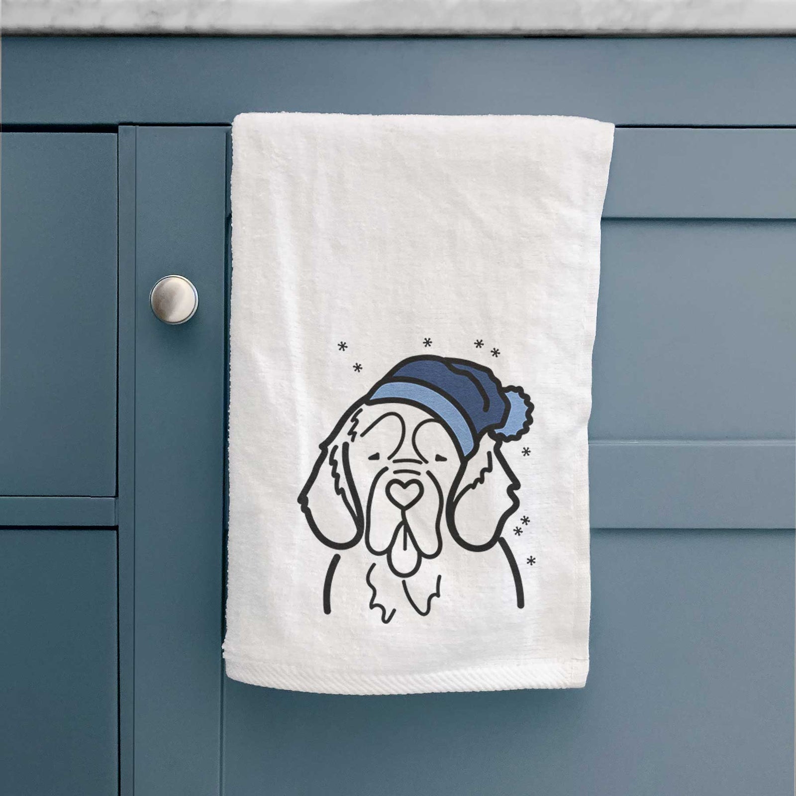 Minimalist line drawing of a Clumber Spaniel wearing a winter beanie on a decorative hand towel