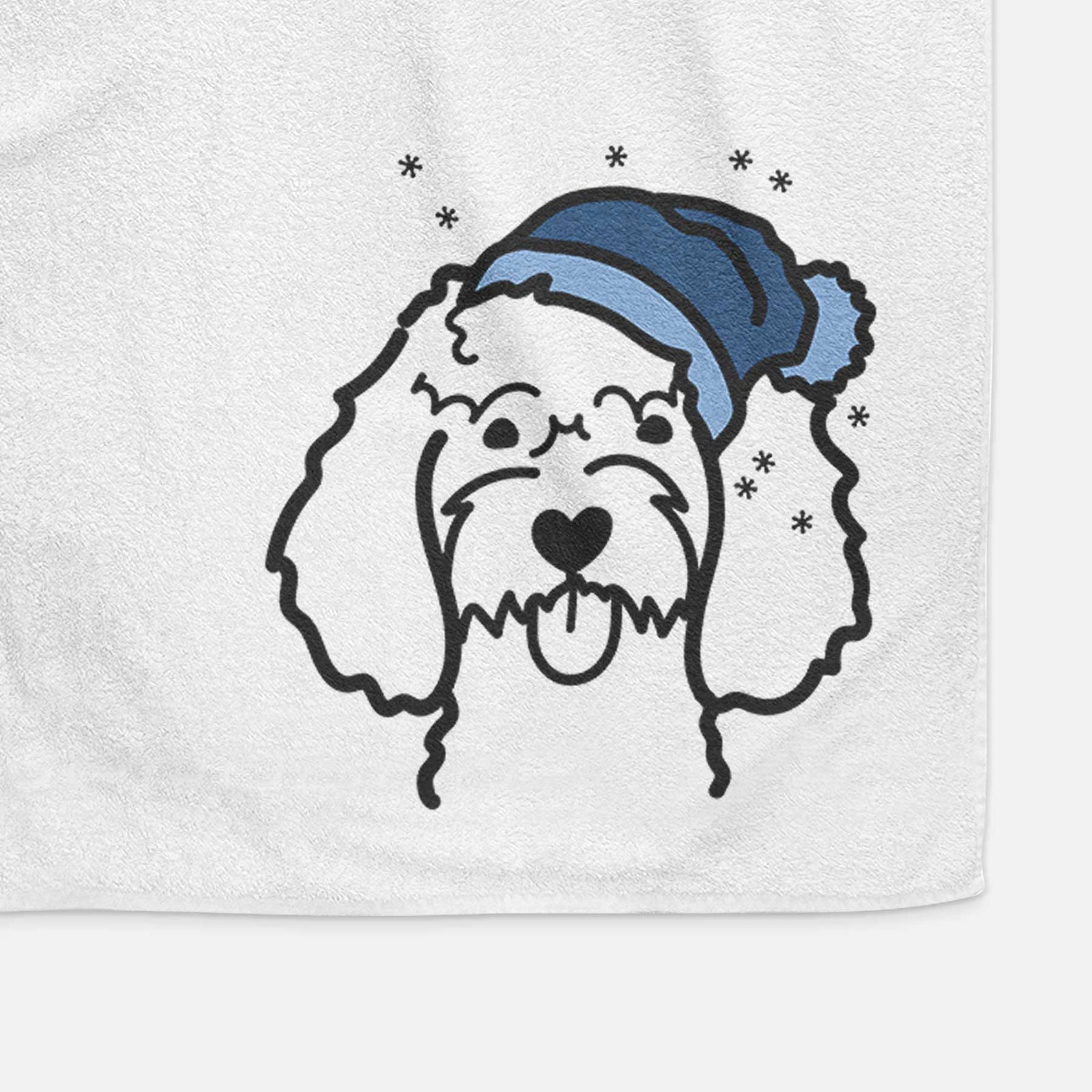 Minimalist line drawing of a Cockapoo wearing a winter beanie on a decorative hand towel