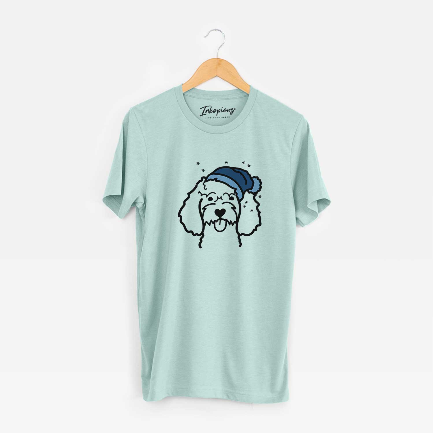 Minimalist line drawing of a Cockapoo wearing a winter beanie on a Heather Sage Unisex crewneck